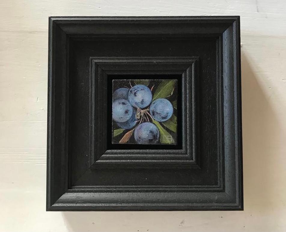 Pocket Sloes [2023] is an original oil painting by Dani Humberstone as part of her Pocket Painting series featuring small scale realistic oil paintings, with a nod to baroque still life painting. The paintings are set in a black wood layered