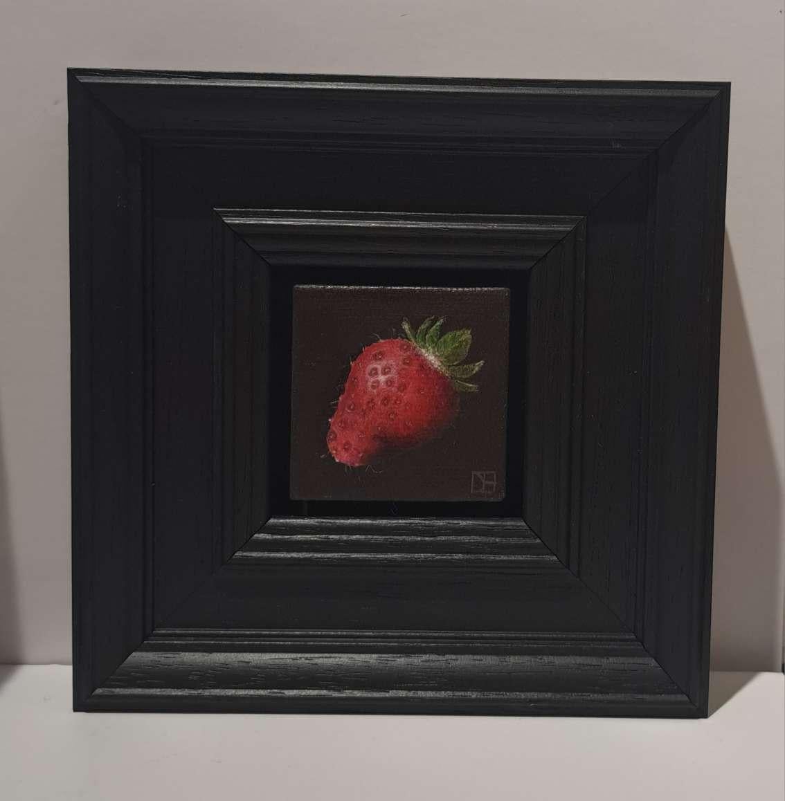 Pocket Very Ripe Strawberry is an original oil painting by Dani Humberstone as part of her Pocket Painting series featuring small scale realistic oil paintings, with a nod to baroque still life painting. The paintings are set in a black wood layered