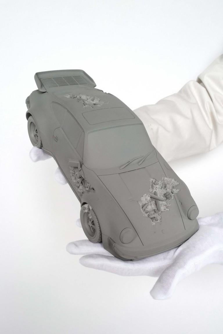 Daniel Arsham
Eroded Turbo 911
Holographic Label of Authenticity
Edition of 500

ERODED 911 TURBO reimagines the iconic 1986 911 Turbo ( 930 ) as a relic from a future archaeological dig site. Geological materials and German engineering come