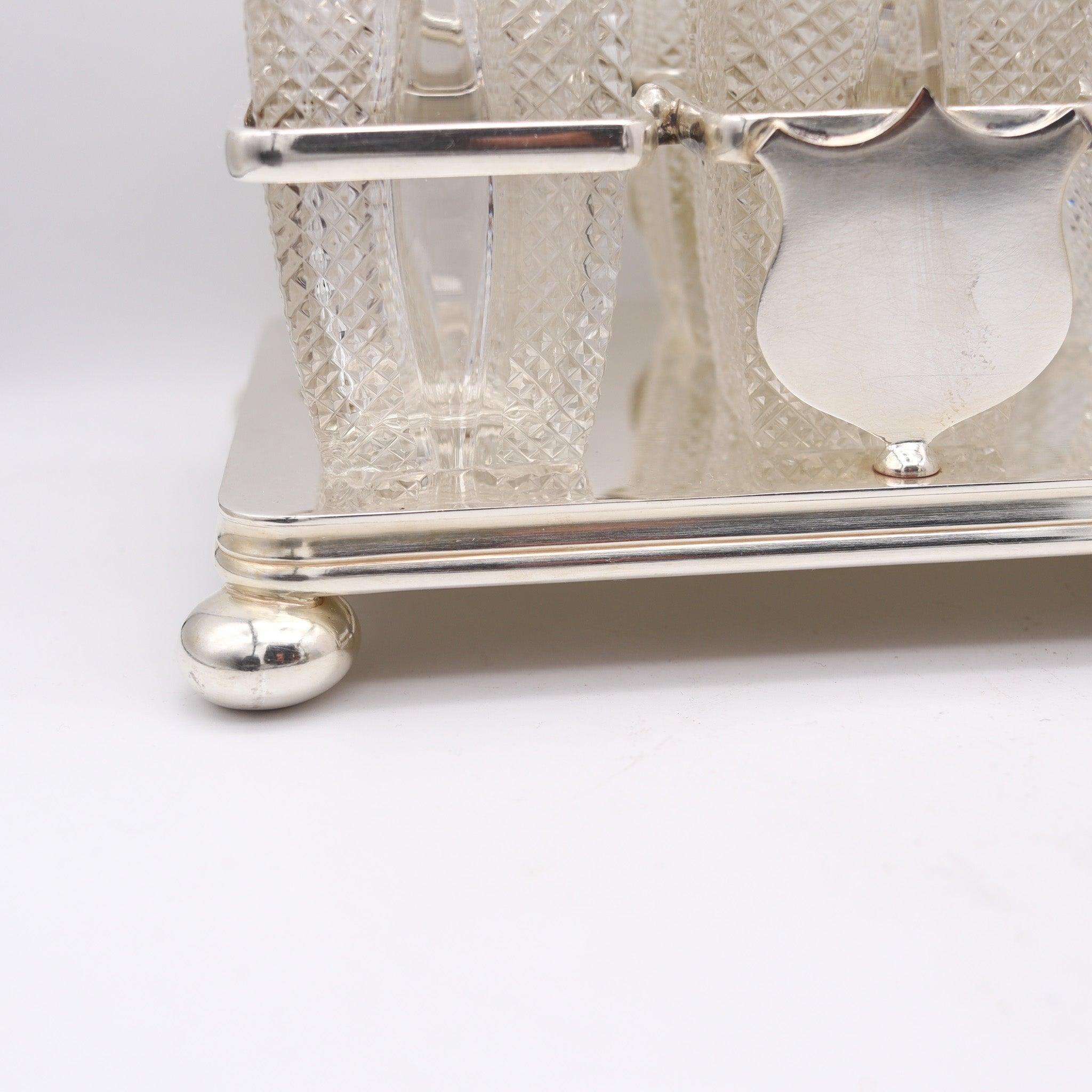 Cruet set made by Daniel & Arter for Bailey Banks & Biddle.

Here we are offering a beautiful & elegant late Victorian silver & hand-cut glass six bottle cruet in its original stand. This rare piece was made in Birmingham England, circa 1890-1900 by