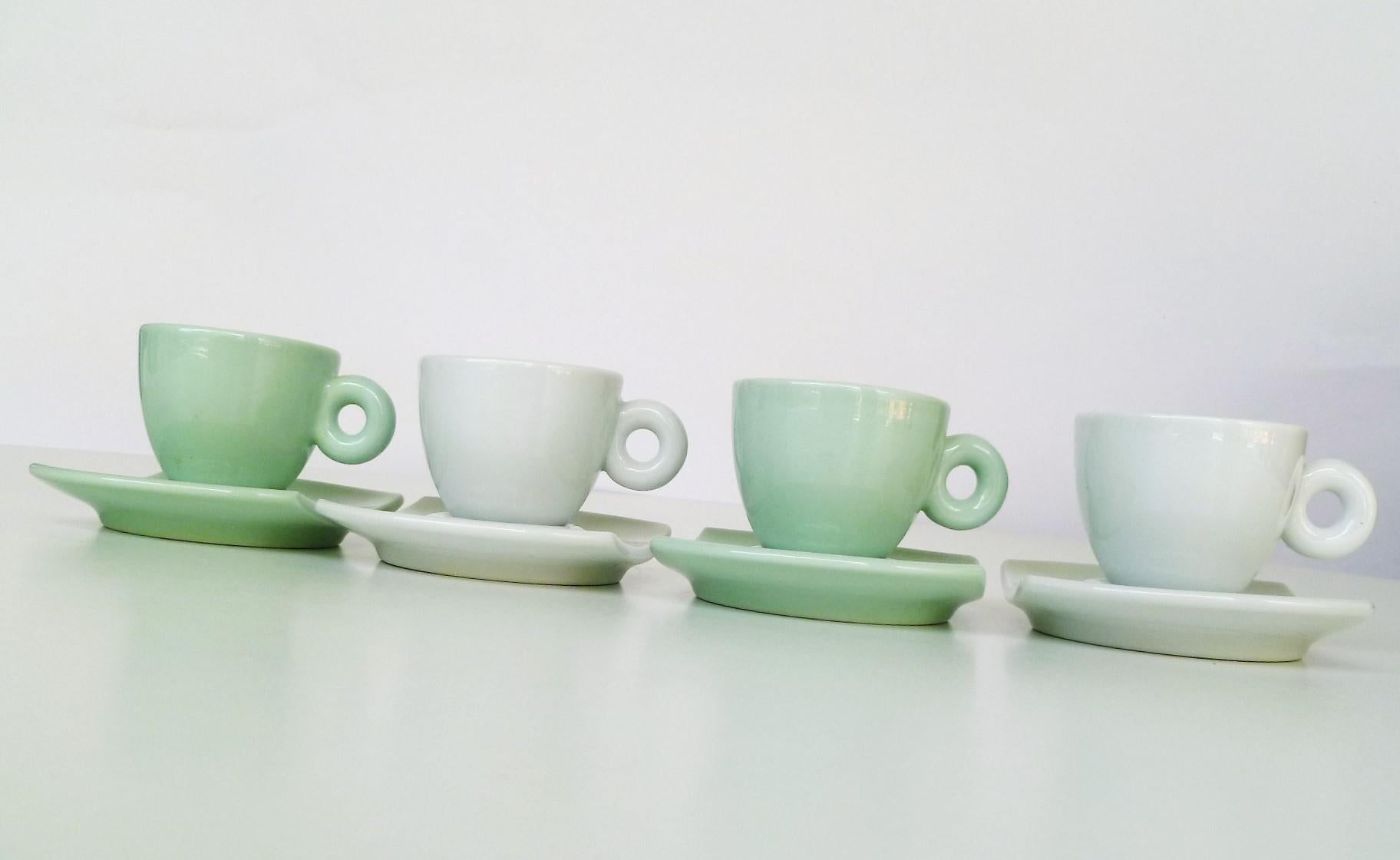 Designed in 2004 by French artist Daniel Buren for Illy Collection, a set of 2 white and 2 celadon Green Espresso or Demi-Tasse cups and saucers. This set is the Bianco Verde grouping, and was also made in the Bianco Blu color scheme, both sets are
