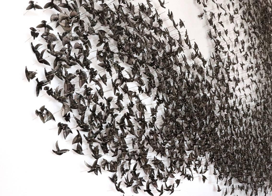 This piece has sold, but the artist can be commissioned to create a unique 'wave', bespoke for you. 

An intriguing work of art, full of nature's beauty and drama - a flock of birds moving in formation.  

Each bird is fabricated by hand in robust