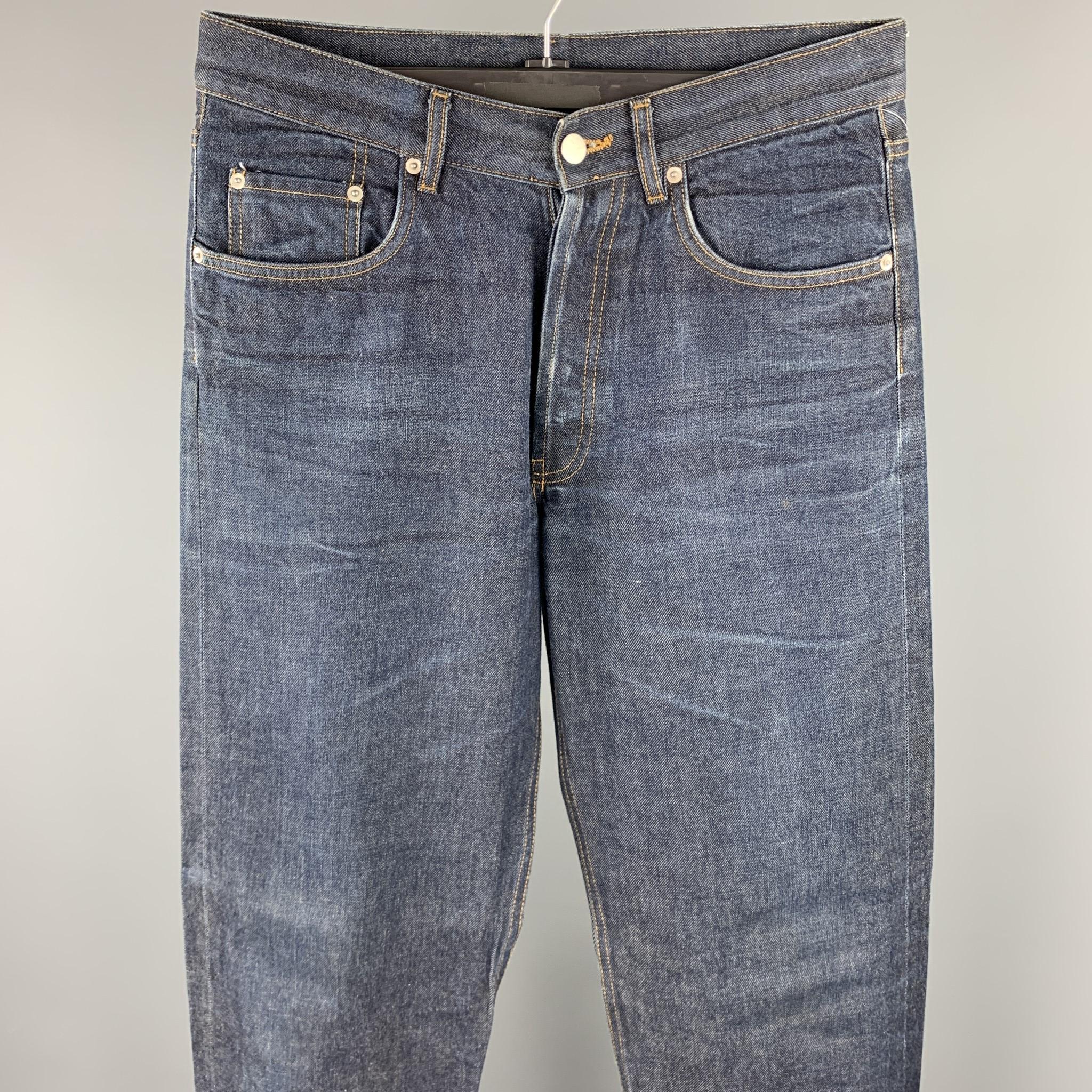 DANIEL CLEARLY jeans comes in a indigo wash selvedge denim featuring a regular fit, contrast stitching, and a button fly closure. 

Excellent Pre-Owned Condition.
Marked: 32

Measurements:

Waist: 32 in. 
Rise: 10 in. 
Inseam: 36 in. 
SKU: