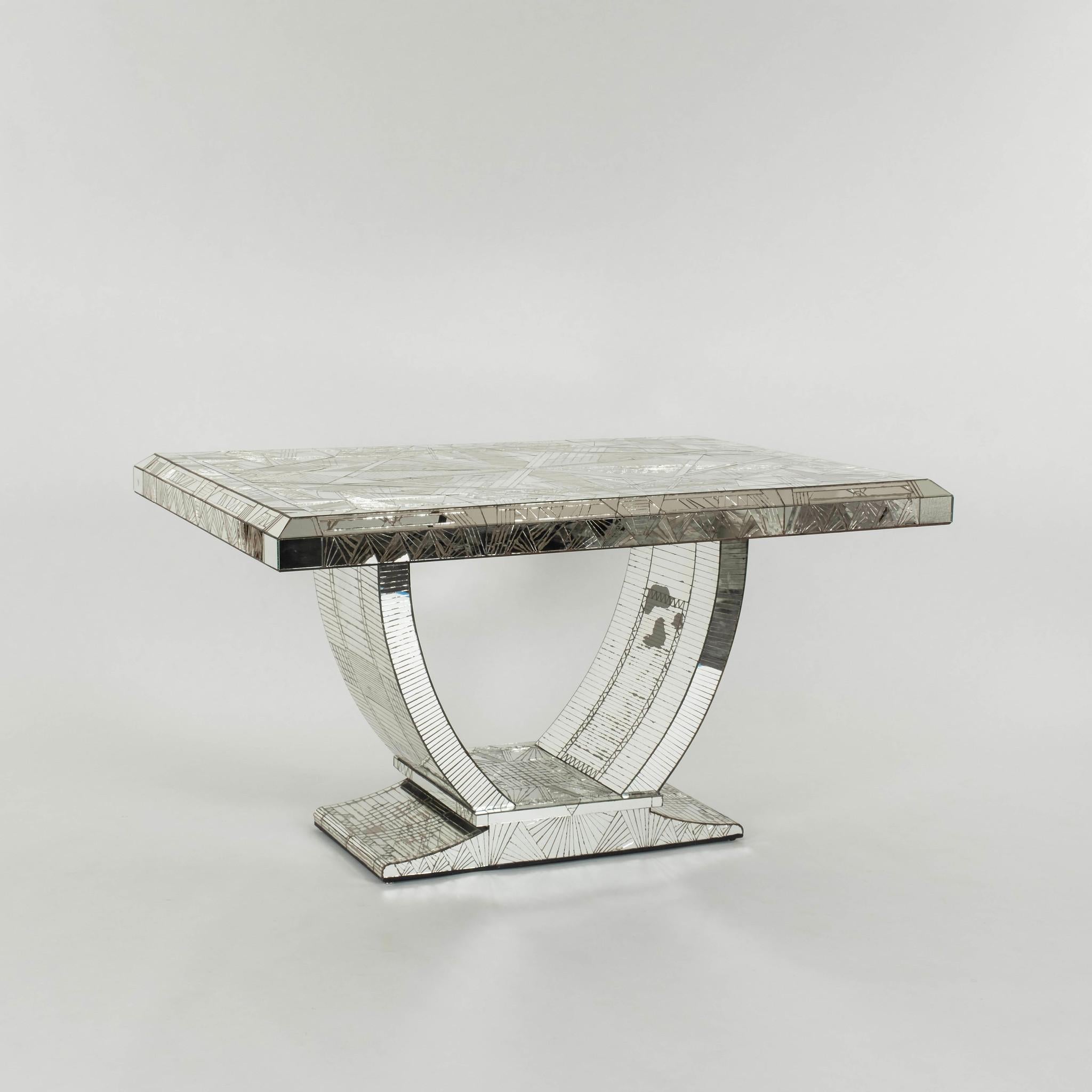 A rare 20th Century French Art Deco style table by Daniel Clément. This table is masterful crafted with individually hand cut and applied mirror tiles designed by the artist. This table works beautifully as a desk, library or dining table.