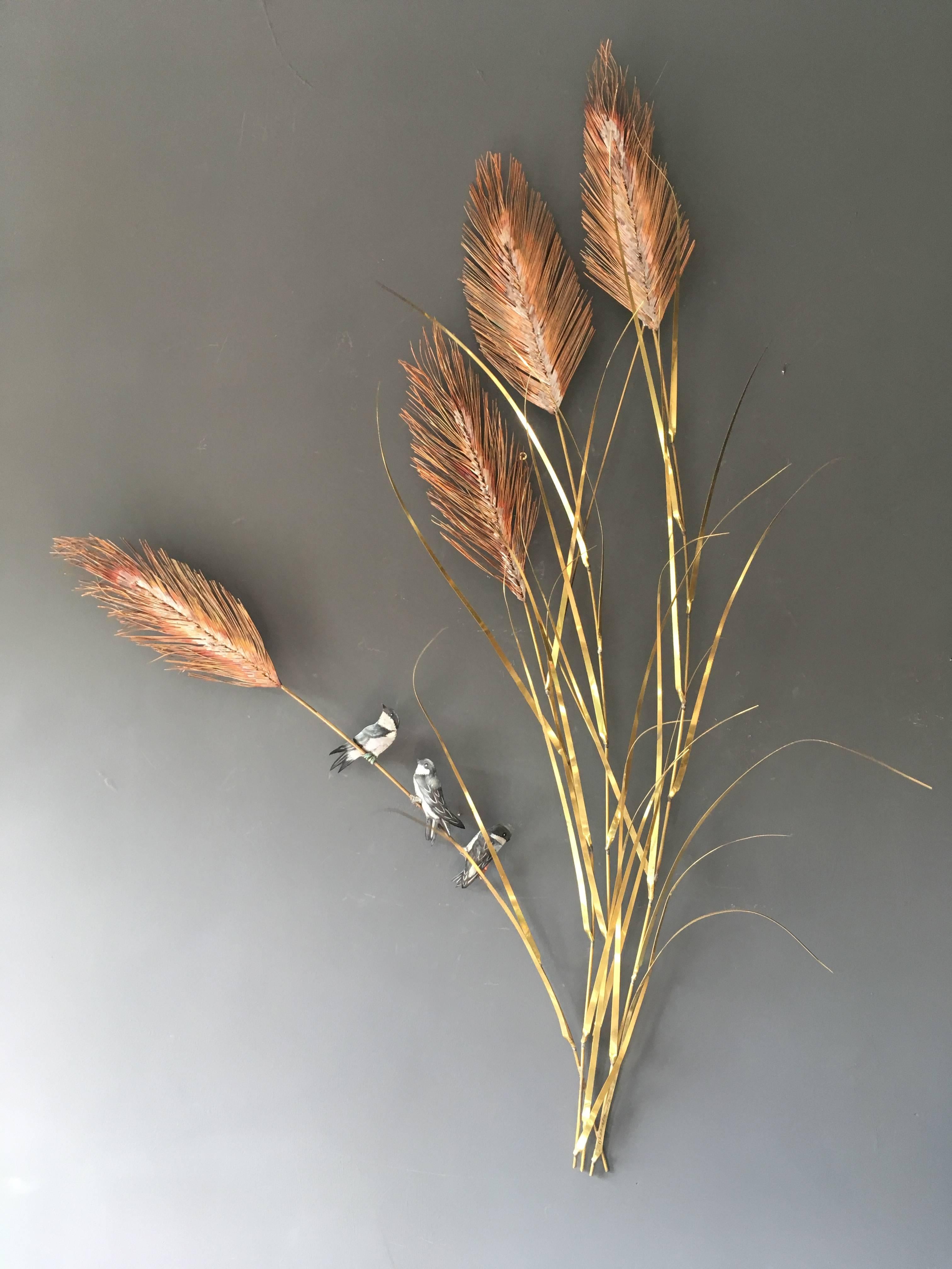 Daniel D'Haeseleer large wall sculpture

The artwork is beautiful and very organic in its shape and movement. The work is 3D and the fine brass grass leaves lean out from the wall in a very natural way

The grass stems and long fine leaves are
