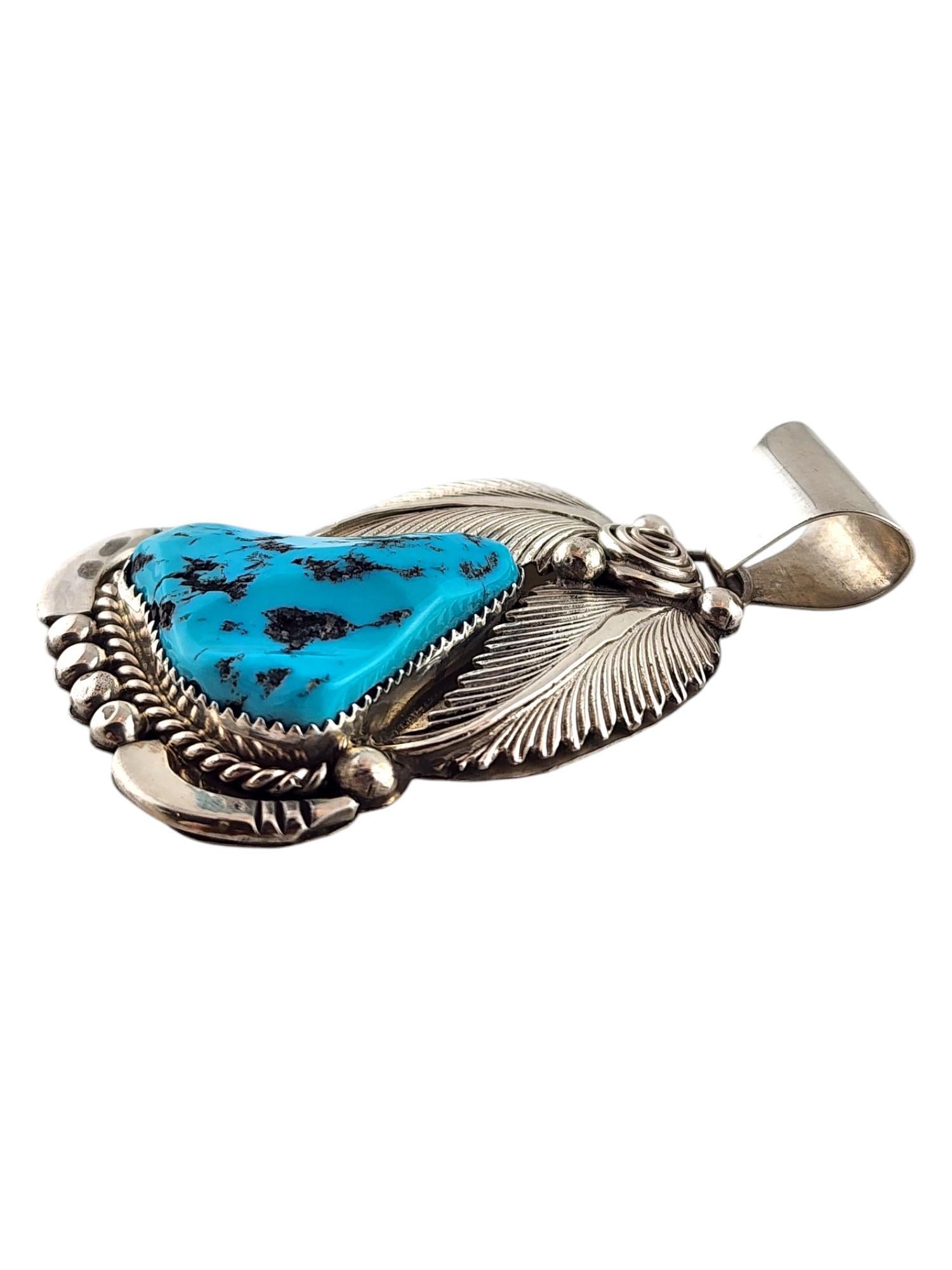 Sterling Silver Navajo Daniel Etsitty Turquoise Pendant 

This gorgeous Navajo pendant was crafted from sterling silver with amazing detailing and a beautiful turquoise pendant!

Size: 68.85mm X 39.25mm X 9.3mm

Weight: 26.64 g/ 17.14 dwt

Hallmark:
