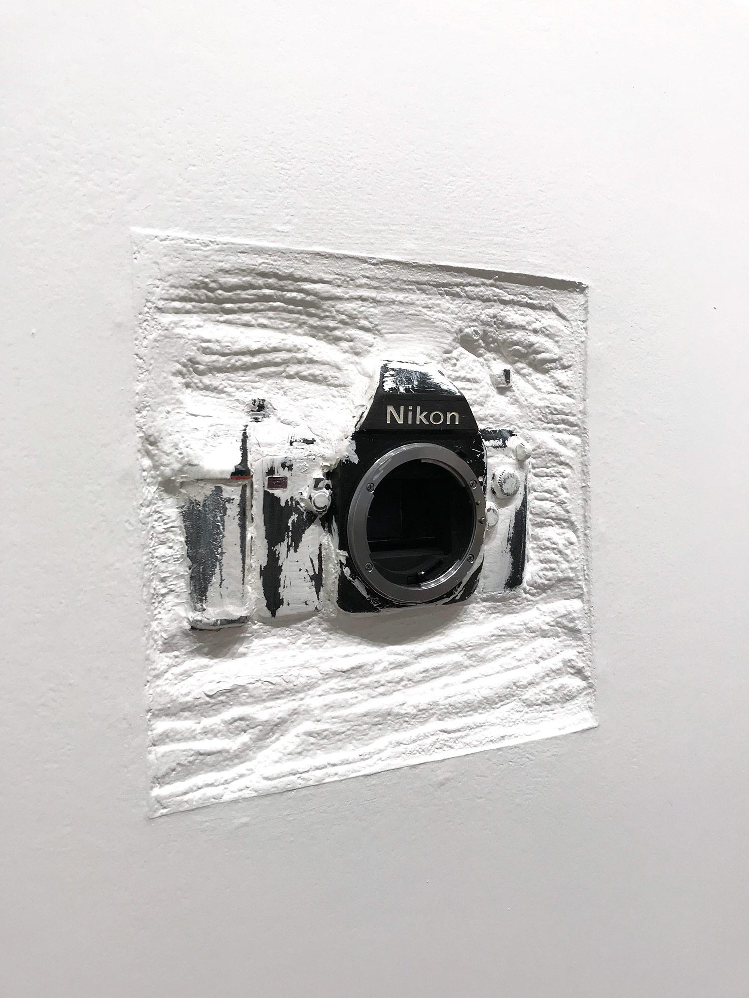 Daniel Fiorda takes objects such as old typewriters and 35mm cameras: “Discarded remnants of the industrial world,” transforming these objects into high-end art. The objects are placed in concrete, creating an altered composition. He then encases
