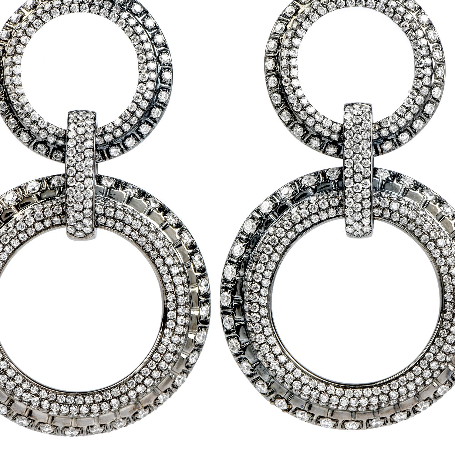 Dance the night away in this trending Estate Diamond 18K Gold triple Circle Dangle Drop Earrings!  These earrings are crafted in 18-karat white gold with fashionable black rhodium plating.  

There are various sparkling genuine diamonds, round cut,