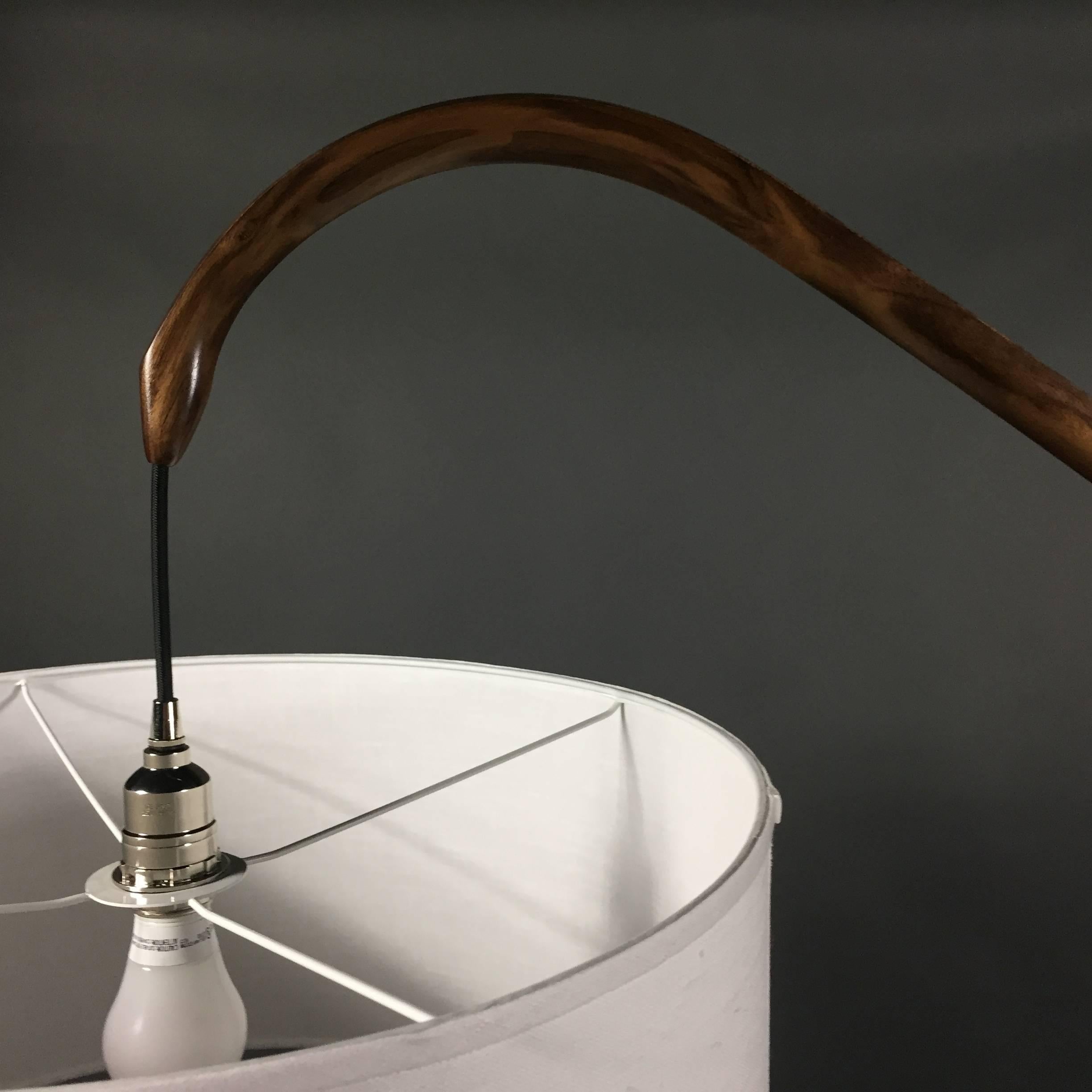 Master craftsman, Daniel Oates created this gorgeous standing lamp in solid walnut that he personally steam-bent in his Sharon CT studio. Graceful curves along the entire length is supported by a tri-pod base. Integrated black cording, white shade