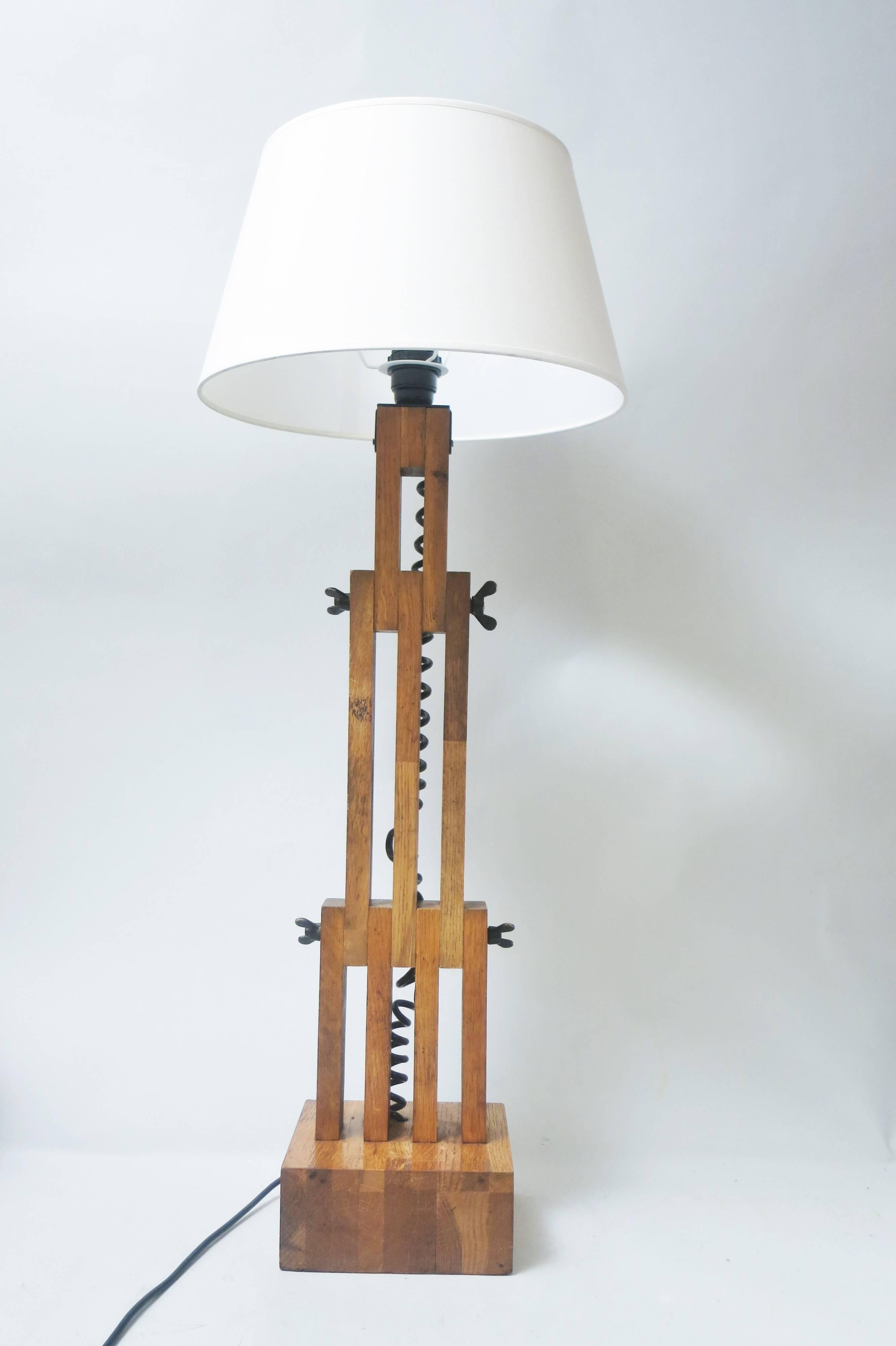 Very rare lamp by French designer Daniel Pigeon (1938-1996) produced by Editions Le chêne sauvage in 1980.
Articulated massive oak pieces on a heavy square base.
This carpenter's work is to be linked with Charlotte Perriand and Pierre Chapo works.