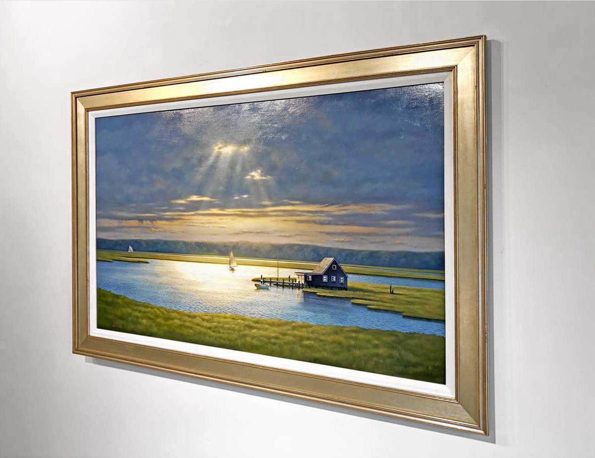 This contemporary realist painting by Daniel Pollera is a landscape of a Bay House in Long Island. The Bay House can be seen to the right, surrounded by water and marshy greenery, with one sailboat sailing by it and another closer to the horizon