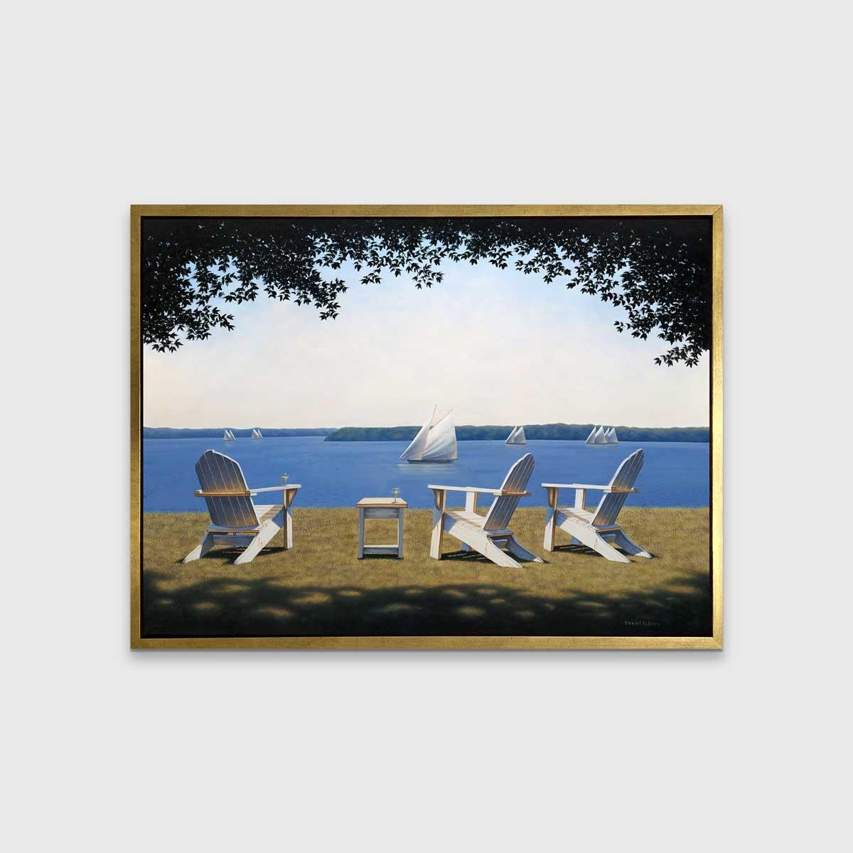 This traditional coastal Limited Edition print by Daniel Pollera pictures three white Adirondack chairs, positioned in the grass overlooking a body of water. Several sailboats can be seen close up and further out along the horizon line. A pale blue