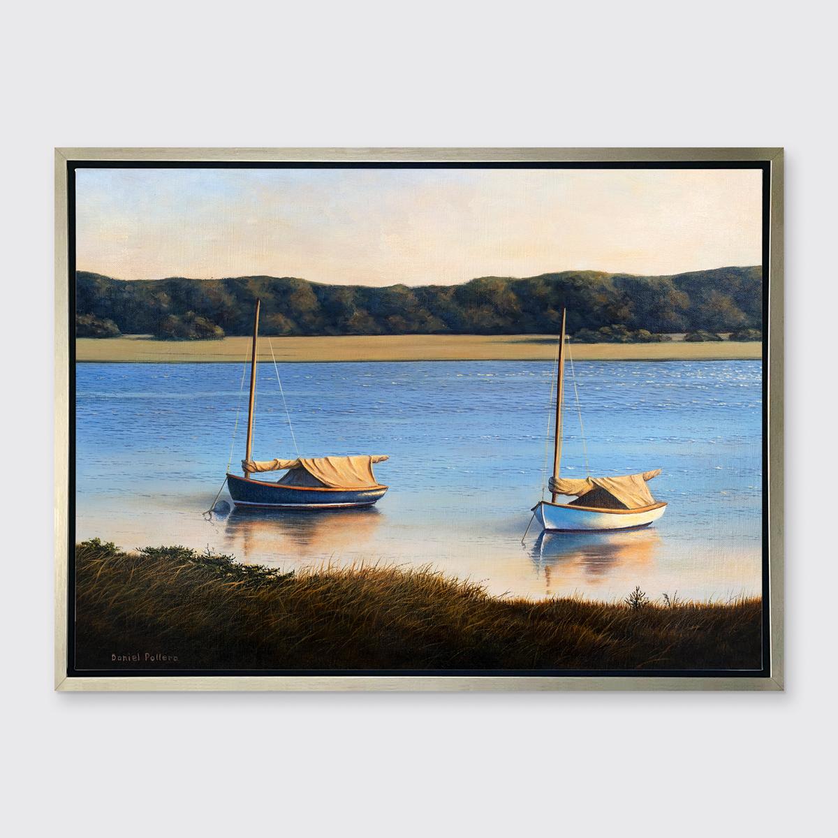 This coastal seascape Limited Edition giclee print by Daniel Pollera captures two small sailboats, one white and one navy blue, anchored along a grassy shoreline in the foreground. The boats' reflections are visible in the pale water, which fades