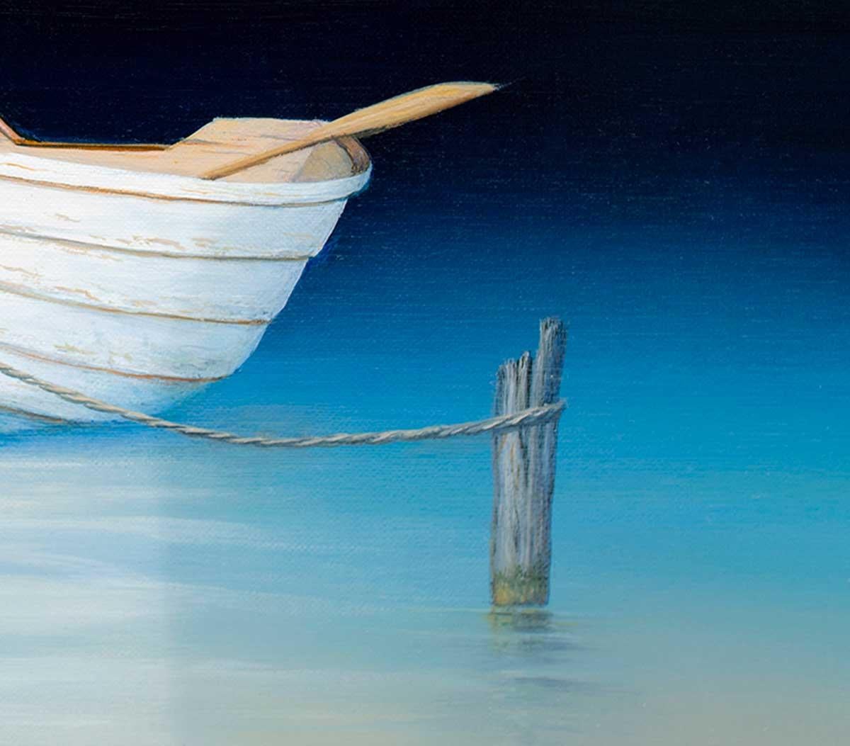 This coastal Limited Edition print by Daniel Pollera features a white row boat with two ores resting on either side of the boat's edge. It is tied to a wooden post in the water with a rope, floating on serene blue water which fades to nearly black