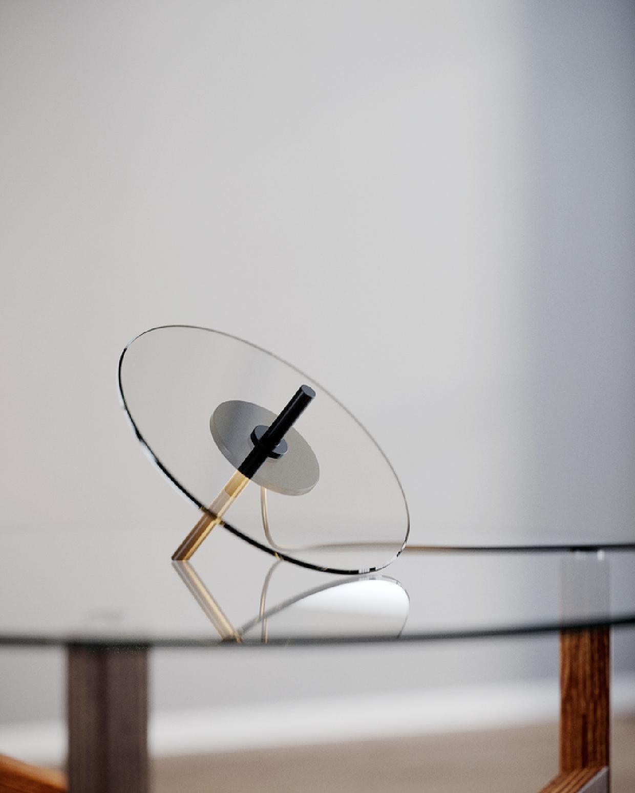 Designed by Daniel Rybakken, whose work occupies the area between art and design, forming limited editions, art installations and prototypes for serial production.

A sculptural and playful piece. The LED light source does not illuminate the disc