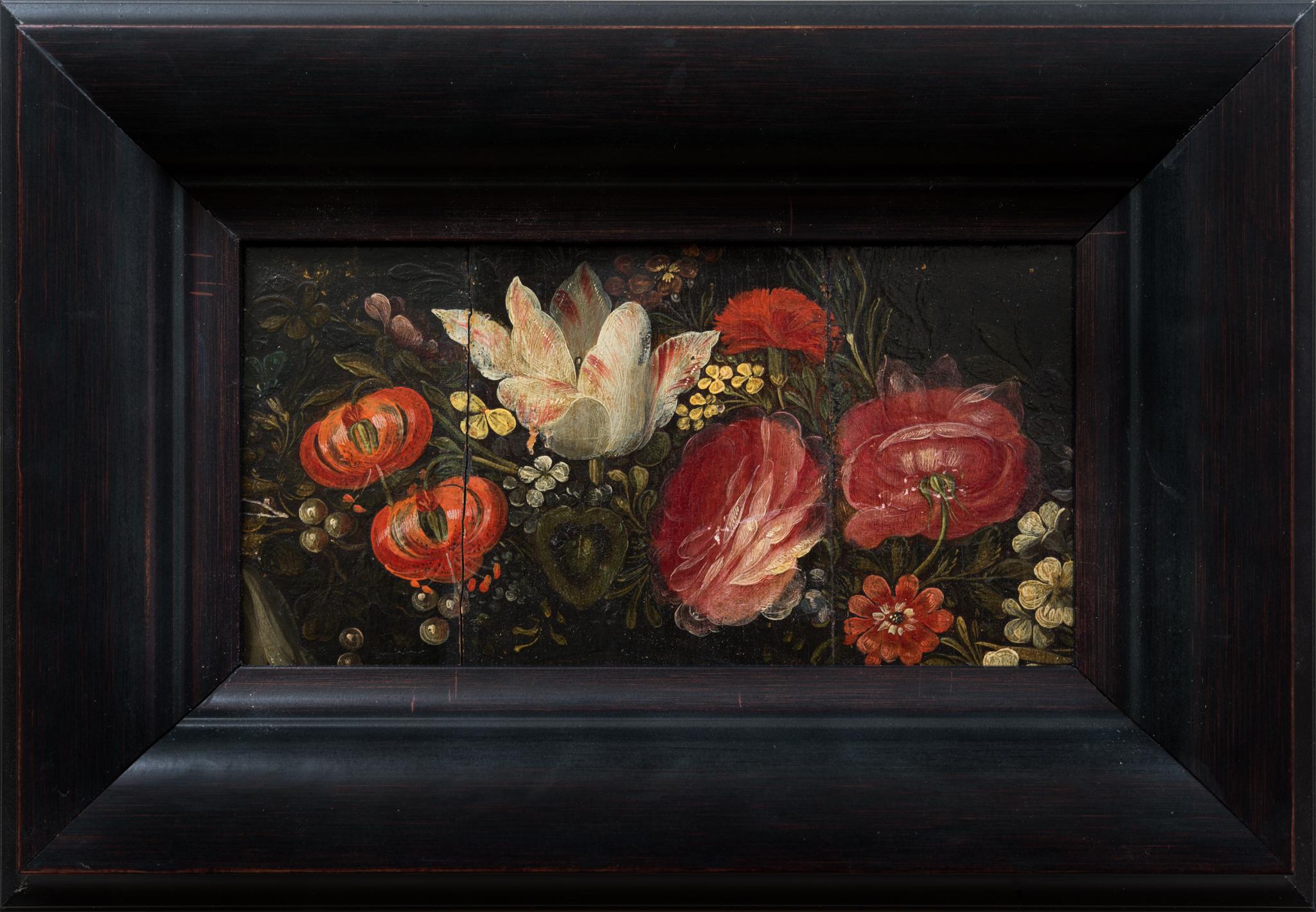 This exquisite floral still life, likely created in the late 17th century, is attributed to a follower of Daniel Seghers. The painting showcases a vivid arrangement of various flowers, including white tulips, red roses, and bright poppies?, all set