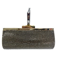 Daniel Swarovski Cartera de mano dorada con cadena