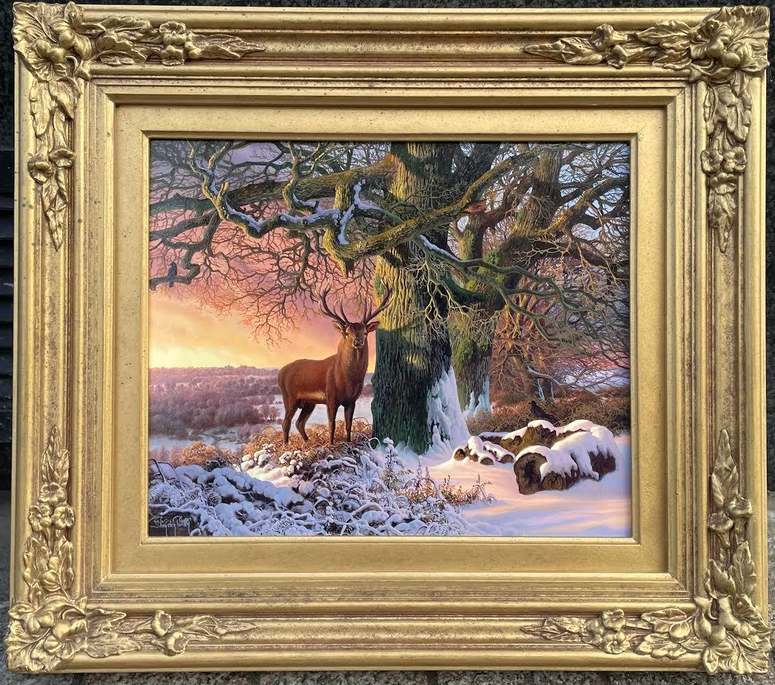 Das großartige Gemälde von Daniel Van der Putten, eine irische Schneelandschaft, zeigt den Killarney National Park in der Grafschaft Kerry in Irland.  
Zeigt einen irischen königlichen Rothirsch, der neben einer großen Eiche auf schneebedecktem