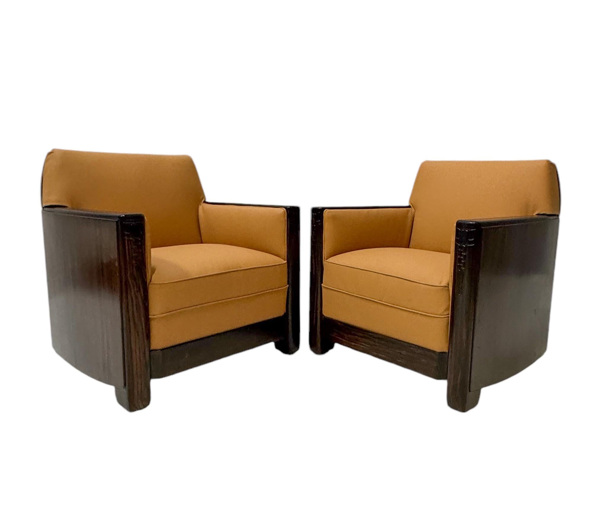 Magnificent and ultra rare pair of Art Deco Amsterdamse School lounge chairs.
Design by Daniël van Dorp for Gebroeders Reens Amsterdam.
Solid macassar ebony and original macassar ebony veneer frames with original hand-carved decorative