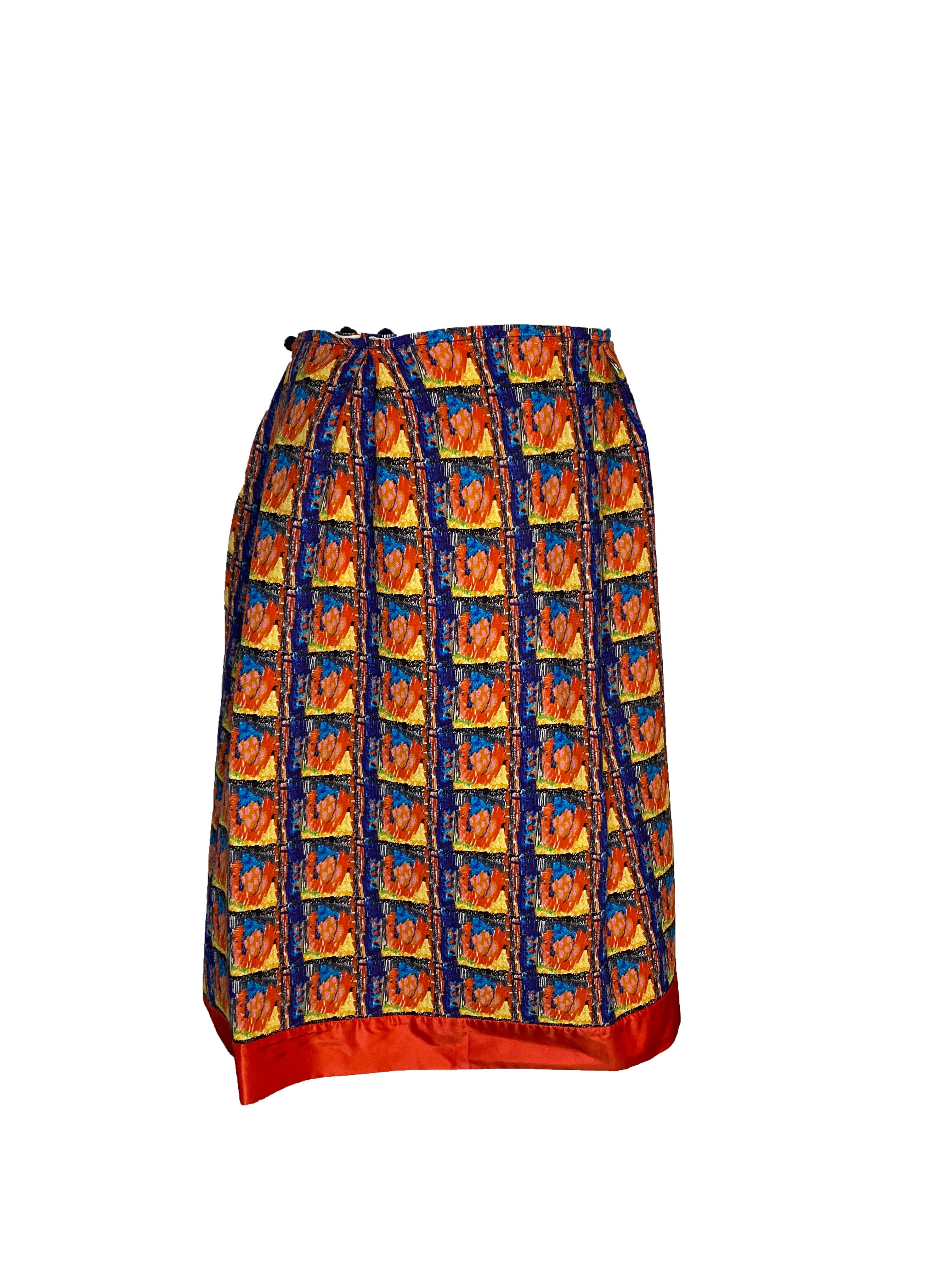 Wool Daniela Gregis skirt from the eponymous brand. Multicoloured pattern in beautiful shades of red, orange, turquoise, yellow and navy. Wrap around style with adjustable fastenings using small wool ball buttons and hooks. Can sit around waist or