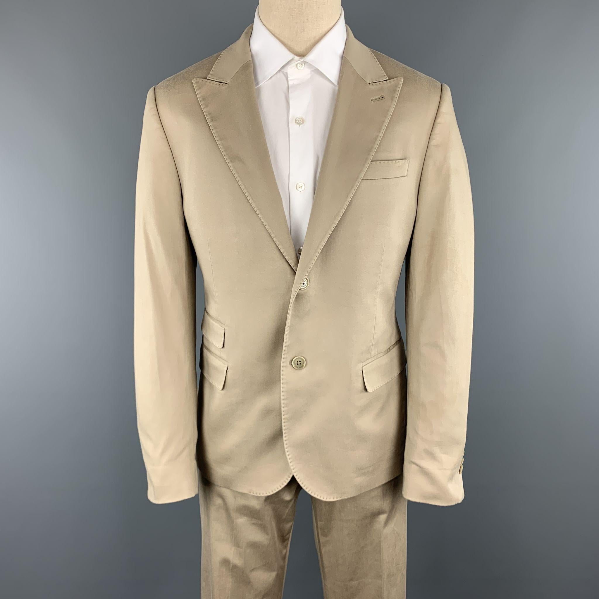  DANIELE ALESSANDRINI Suit comes in a khaki solid cotton / elastane material, and includes a two buttons sport jacket with a peak lapel, and a double vent at back, and matching trousers. Wear at sleeve. Made in Italy.

Good Pre-Owned