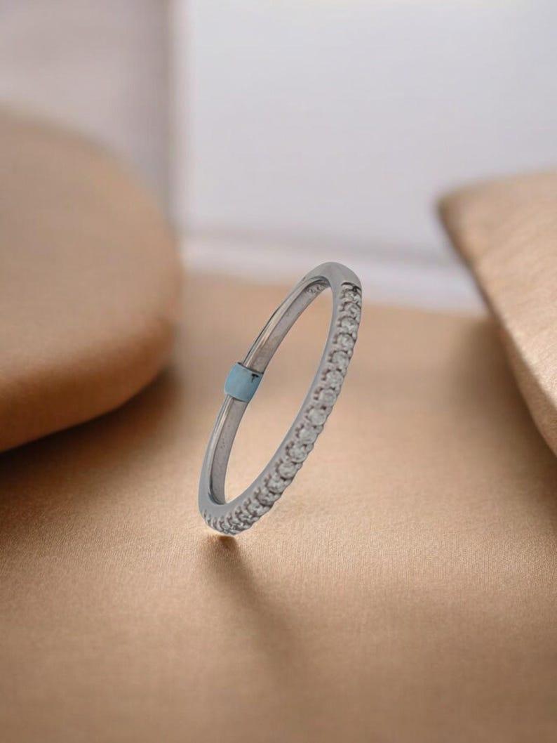Celebrate timeless love and elegance with the Danielle Anniversary Band. Crafted in 14k white gold, this exquisite band is adorned with .45 carat total weight (ctw) of brilliant white diamonds, each meticulously prong-set to maximize sparkle.