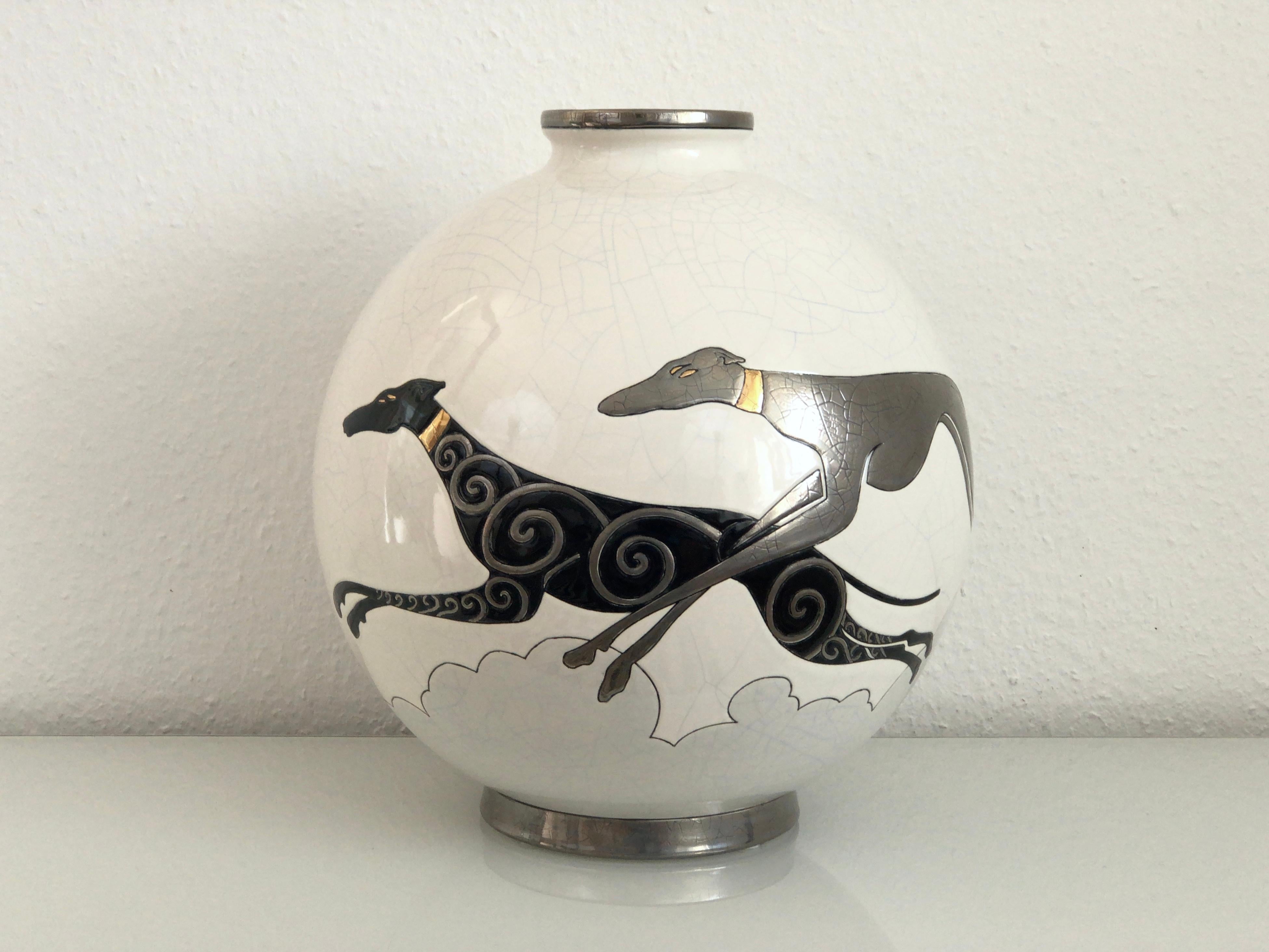 Emaux de Longwy ceramic vase with craqueling glaze
White body with greyhounds 
Limited edition: number 7 of 50 

Danillo Curetti (1953-1993) was one of the first great names in the contemporary creations of Les Emaux de Longwy. The edition of