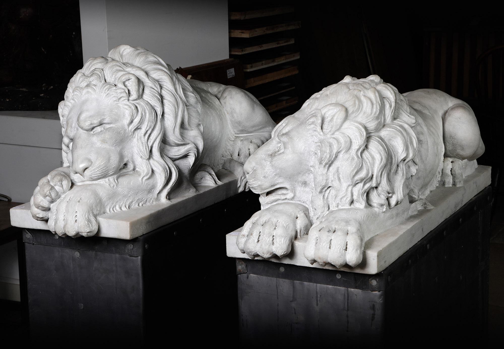 This impressive pair of white marble lions was sculpted by the renowned Italian artist Danilo Cervietti (20th Century). The sculptures are loosely modeled after the style of Antonio Canova (Venetian, 1757-1822), with one lion portrayed sleeping and