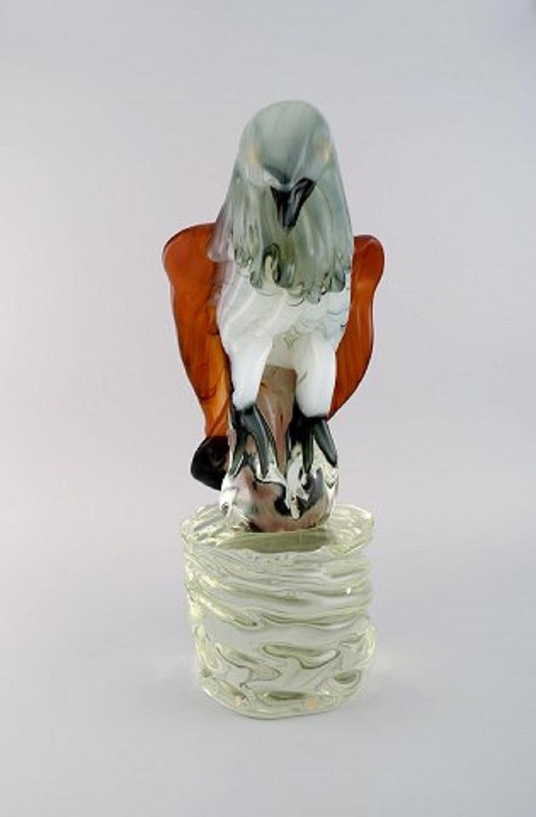 Danilo Zanella for Murano. Large sculpture in mouth-blown art glass. Eagle on pedestal, 1980s.
Measures: 43 x 24 cm.
In excellent condition.
Engraved signature.