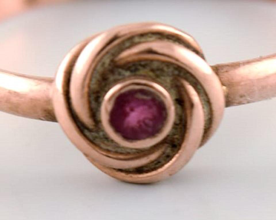 gold ring with purple stone