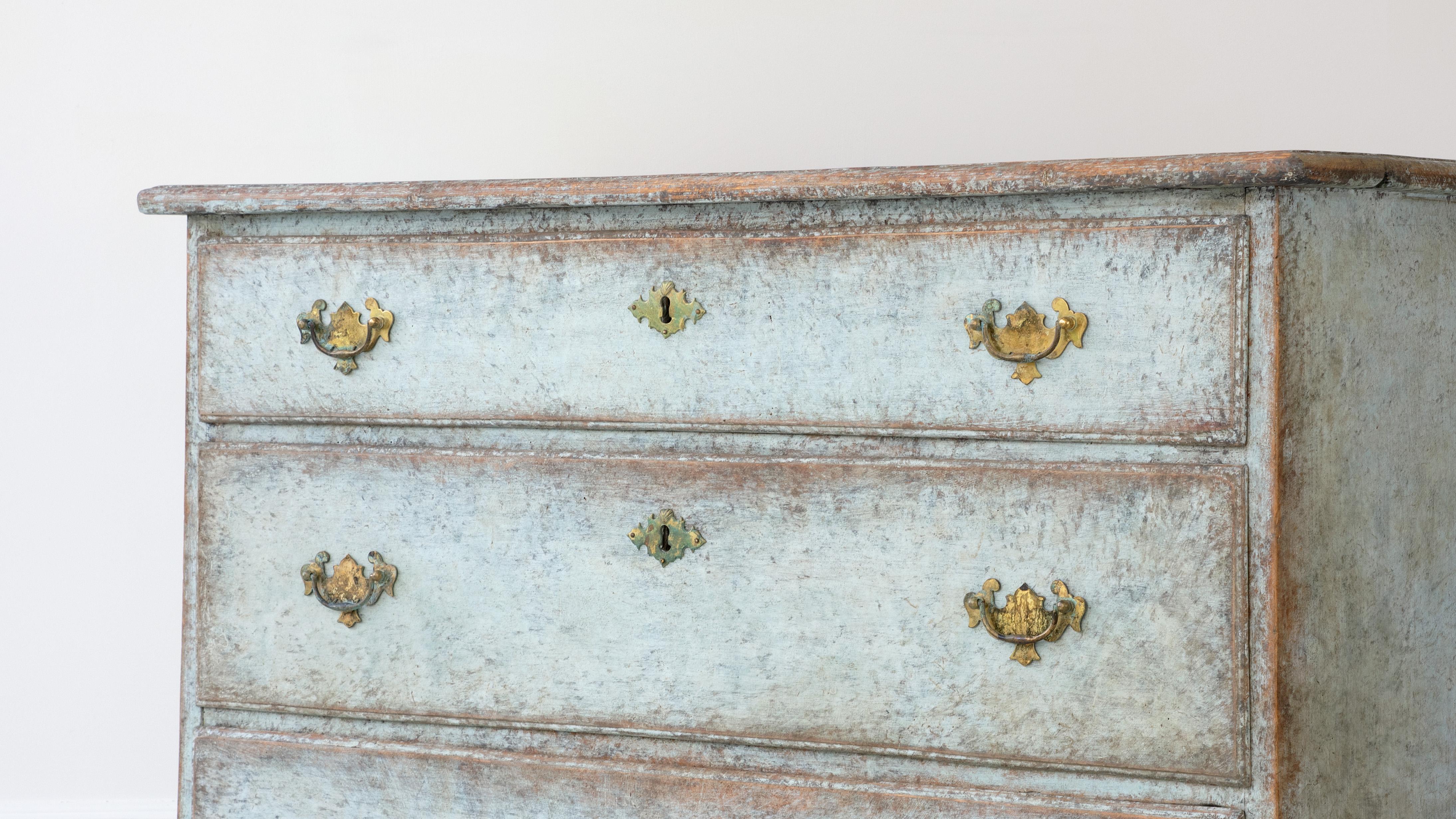 Danish late Gustavian 1820s distressed blue grey painted wood chest with three graduating graduating drawers and bracket feet. This Danish Late Gustavian chest of drawers circa 1820, combines functionality and aesthetics with subtle elegance. Its