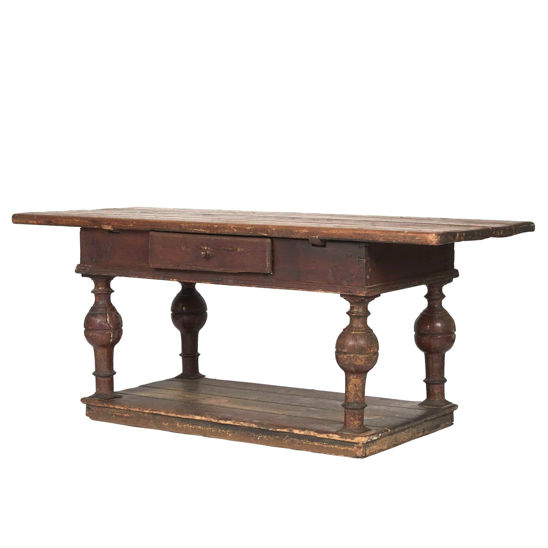 Danish baroque table in original, untouched condition.
Made in pine wood. Brown-ocher colored frame with one drawer to the front resting on typical baluster-shaped baroque legs on bottom base.
The table has a natural, very charming, age-related