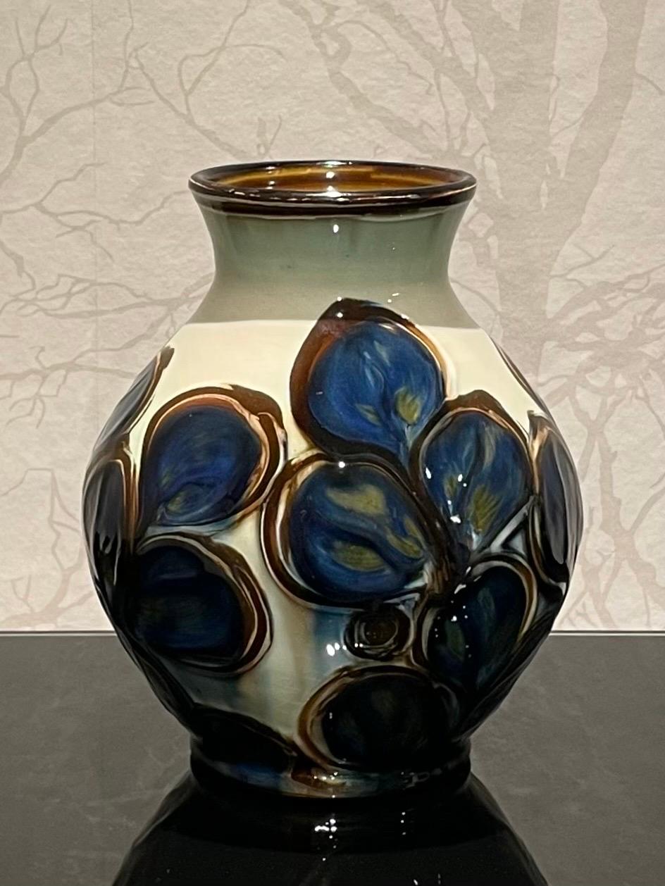 This is the Danish 1920s Herman Kähler vases collection in mint condition. 

The collection consists of three vases in different shapes and sizes. They comes with a very glossy surface and cow horn glazed patterns of flowers and leaf’s. 
The