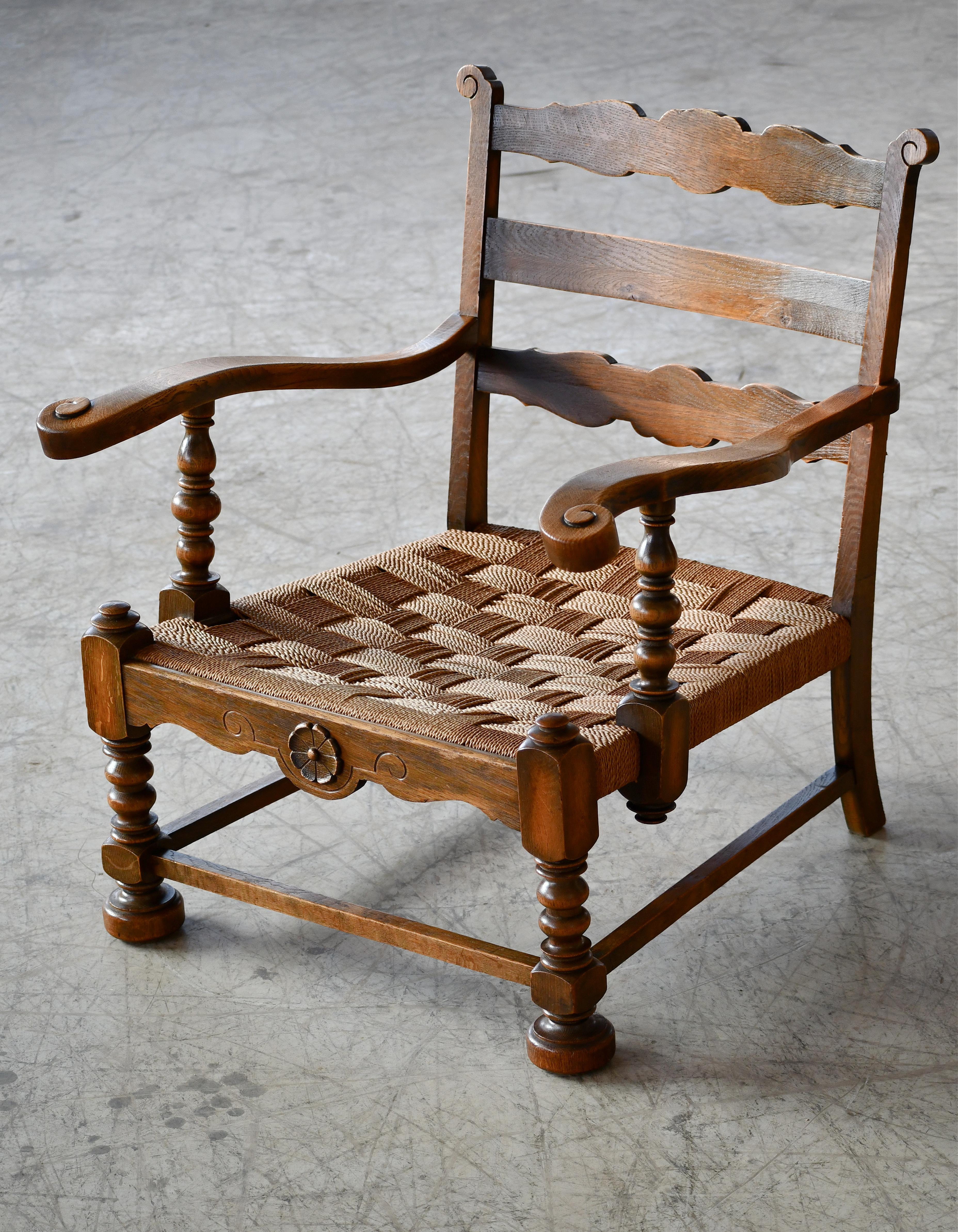 Great country style armchair made in Denmark in the early part of the 20th century. Hand carved from solid Mahogany and stained. Over time the chairs have achieved an absolutely remarkable patina. The wood is in overall good solid sturdy condition
