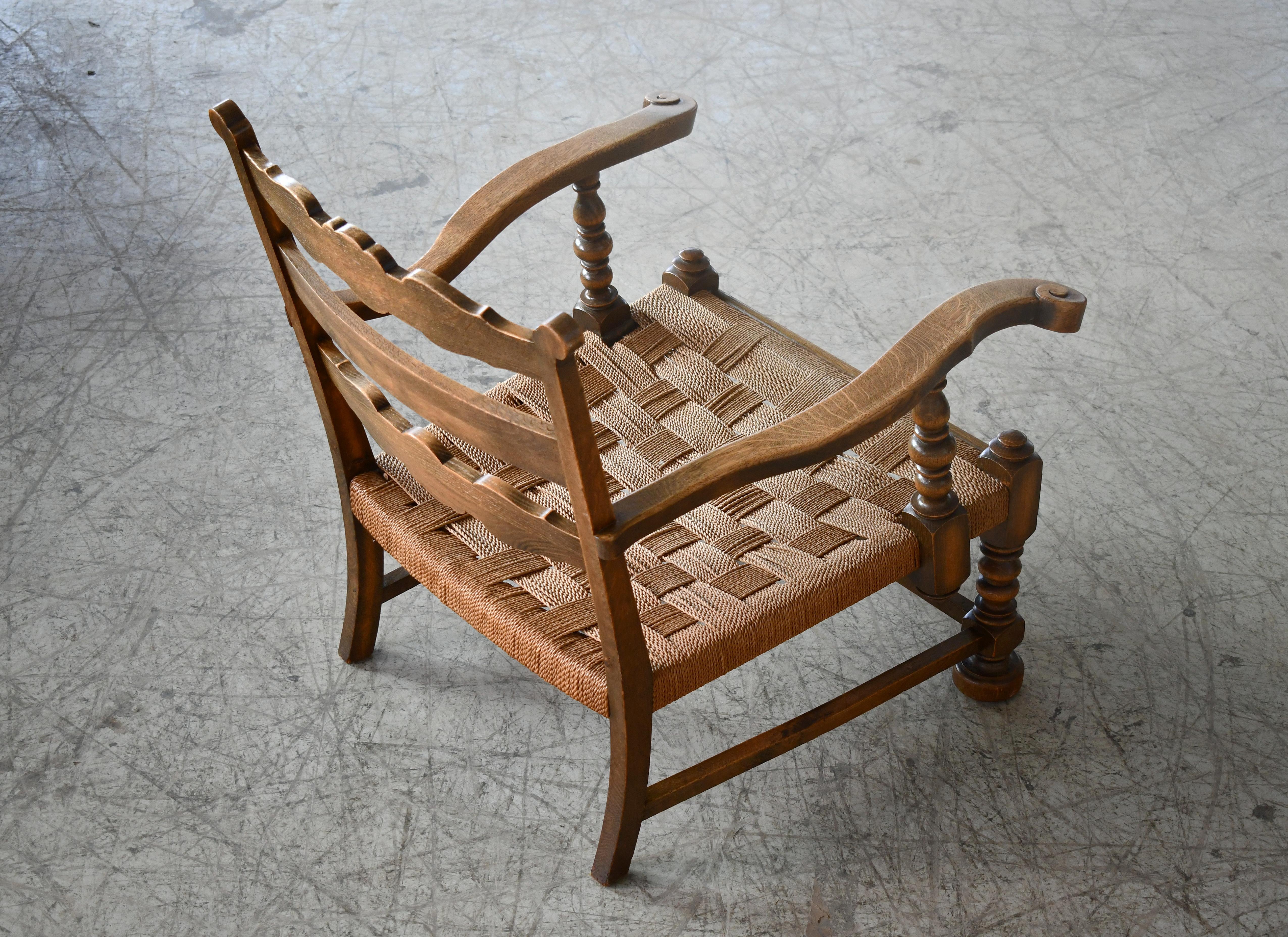 Mid-Century Modern Danish 1930 or 1940s Carved Mahogany Armchair with Rush Seat For Sale