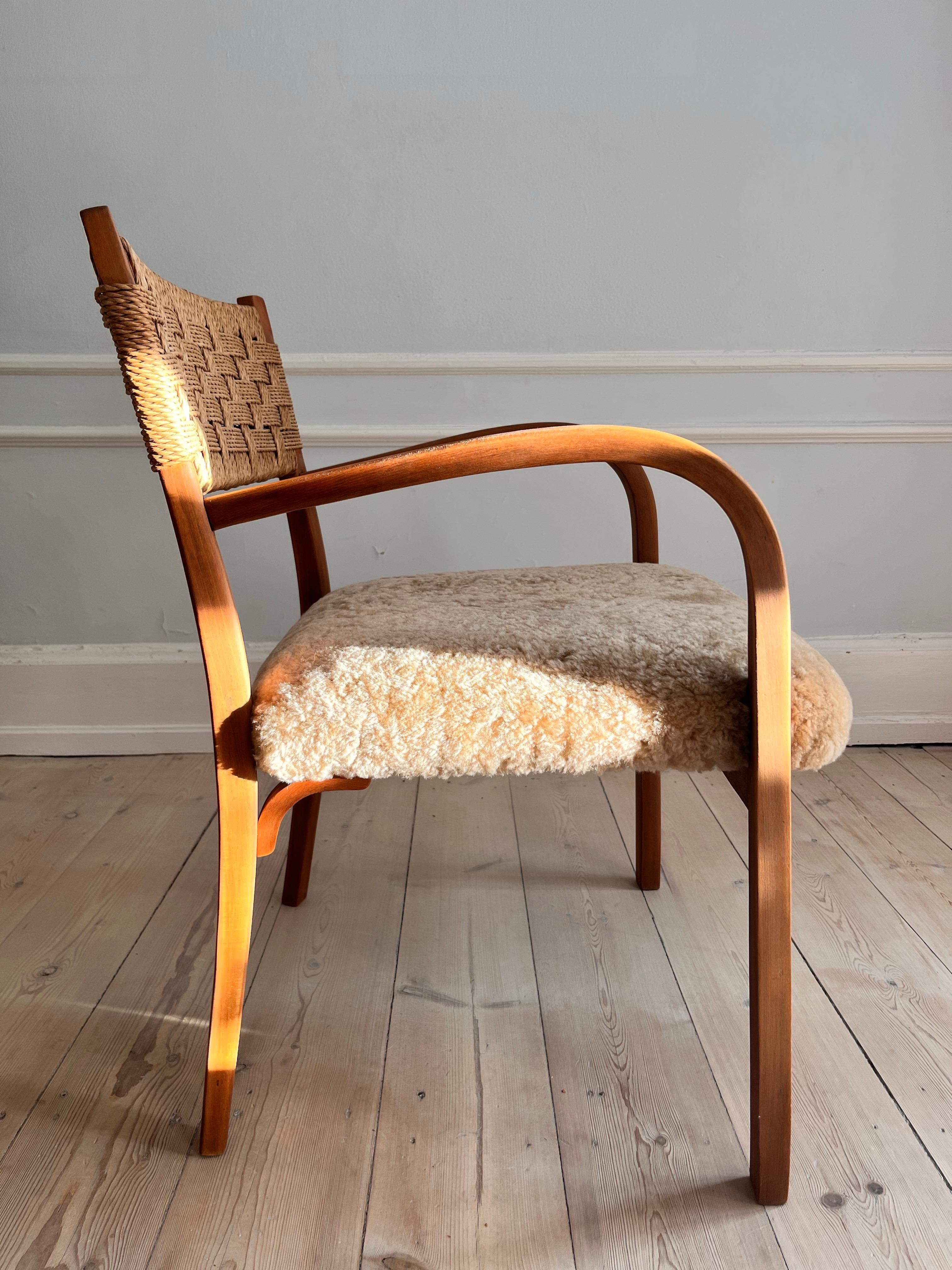 Mid-20th Century Danish 1930s armchair with reupholstered seat i soft lambskin For Sale