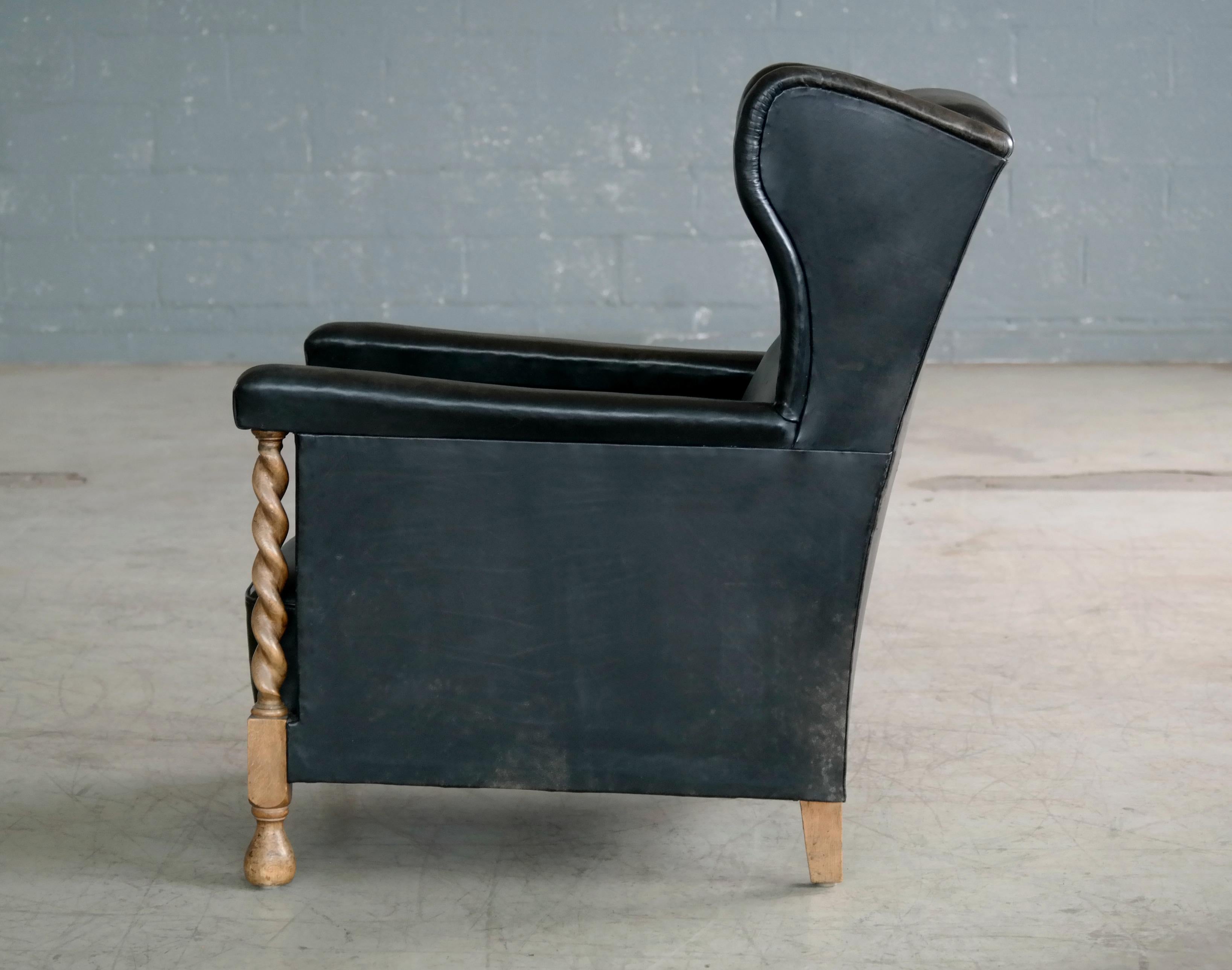 Danish 1930s Large Scale Club or Wingback Chair in Black Leather and Carved Oak 4