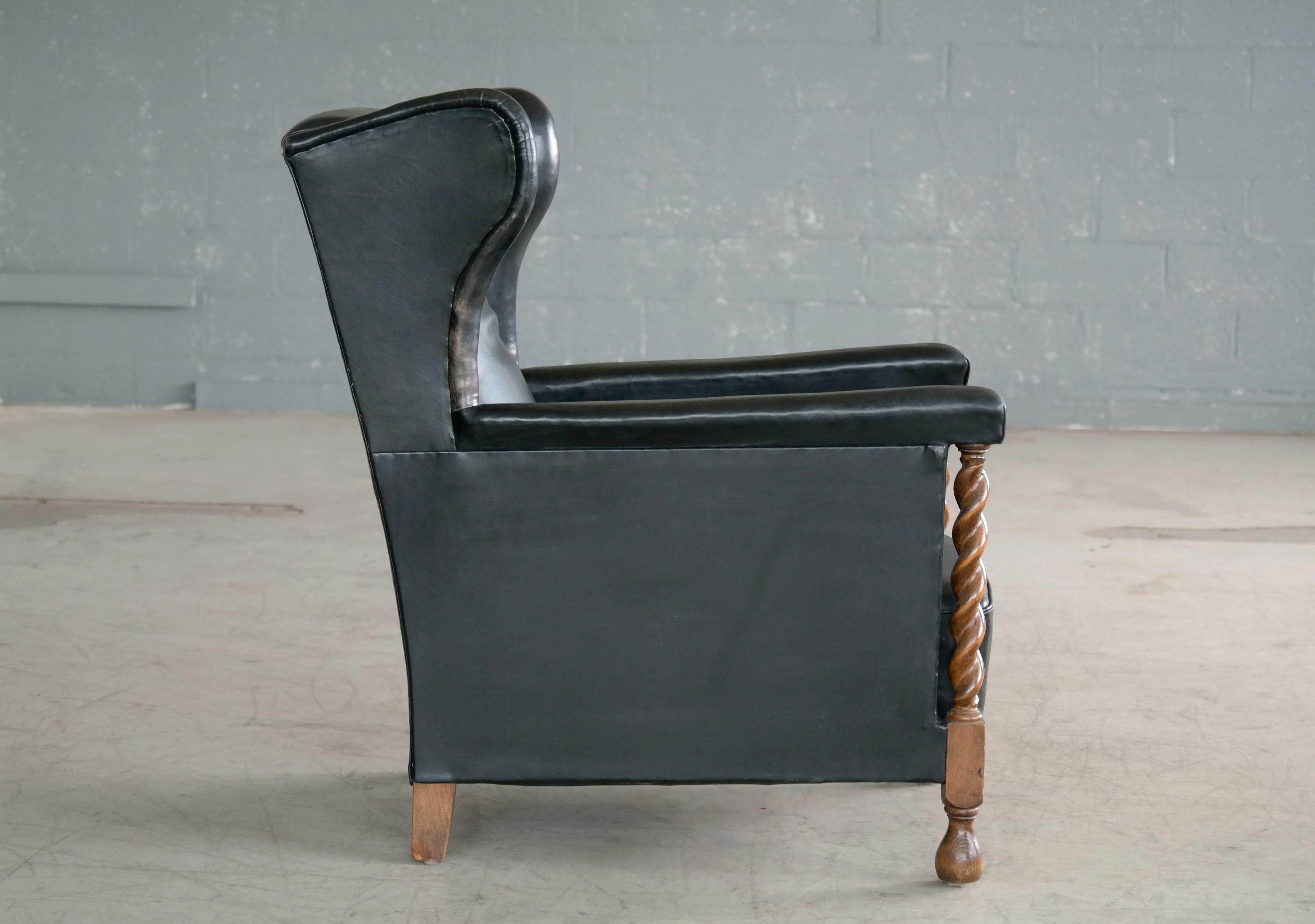 Danish 1930s Large Scale Club or Wingback Chair in Black Leather and Carved Oak 5