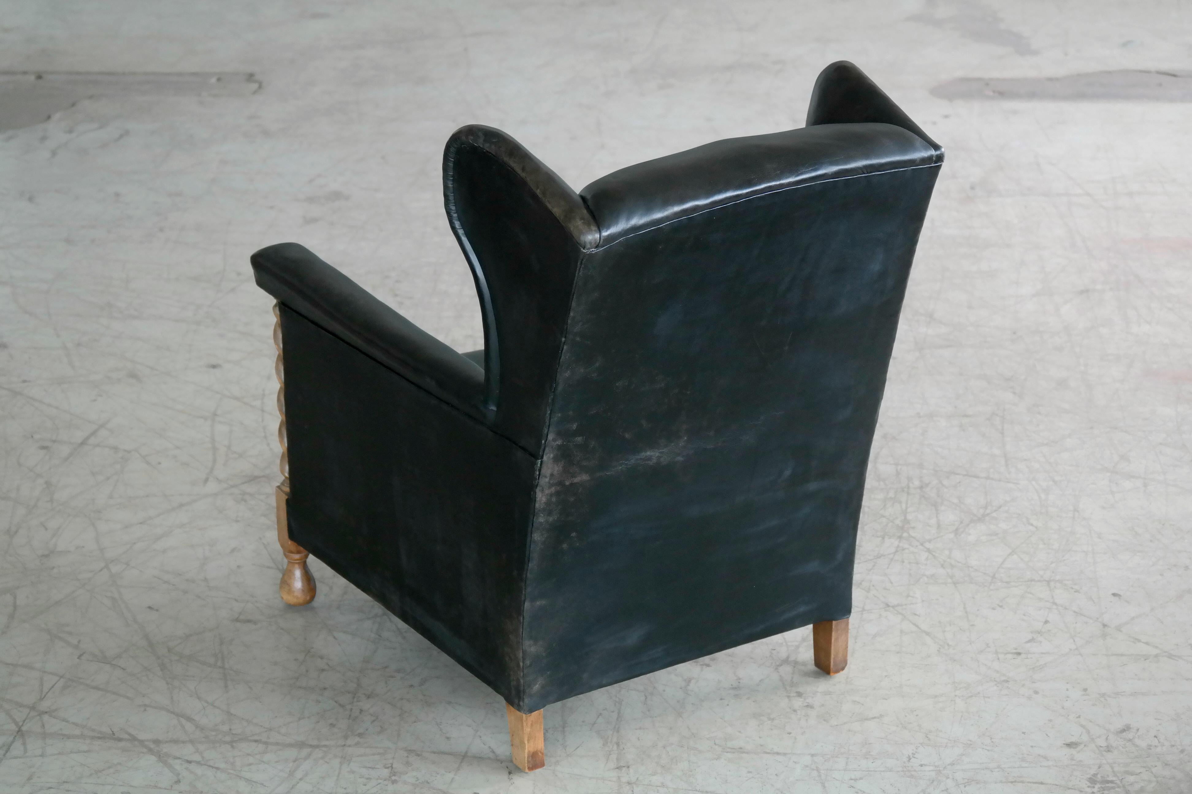 Danish 1930s Large Scale Club or Wingback Chair in Black Leather and Carved Oak 7