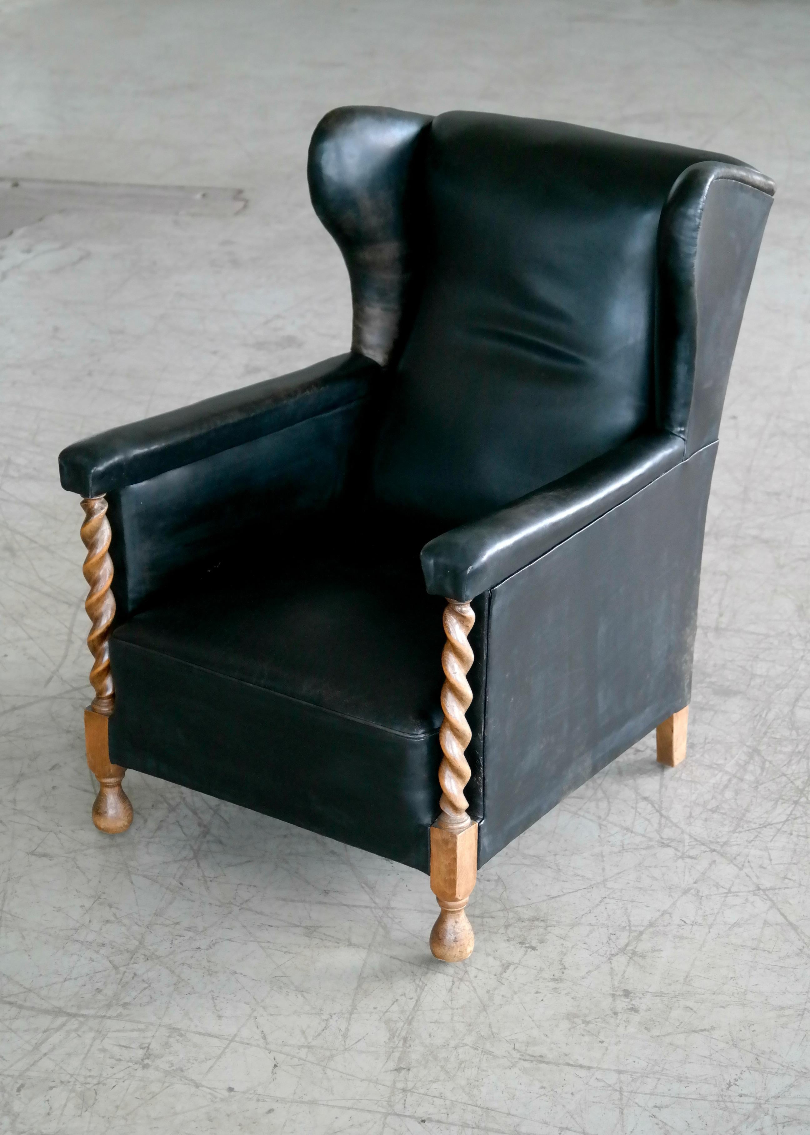 Danish 1930s Large Scale Club or Wingback Chair in Black Leather and Carved Oak In Good Condition In Bridgeport, CT