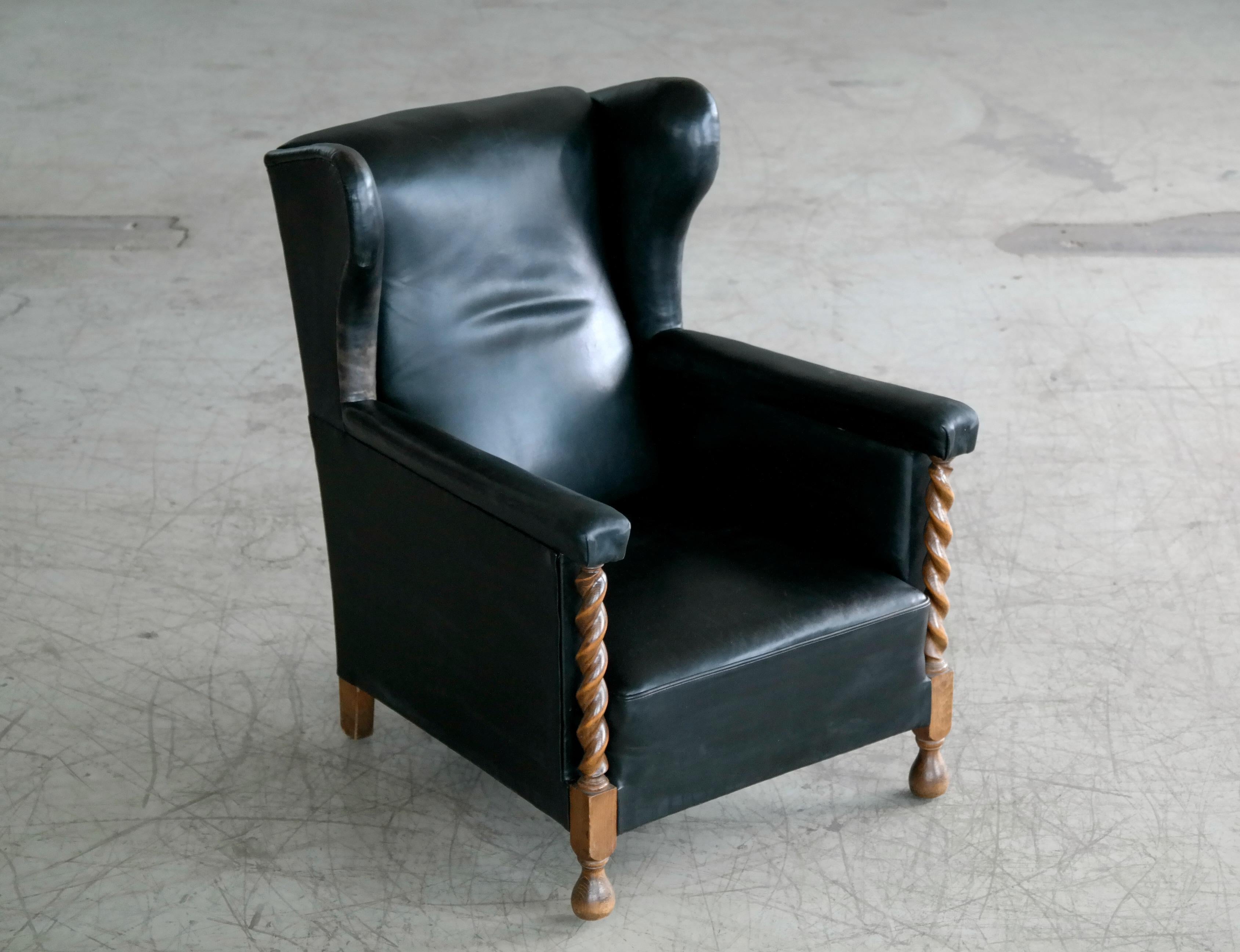 Danish 1930s Large Scale Club or Wingback Chair in Black Leather and Carved Oak 2