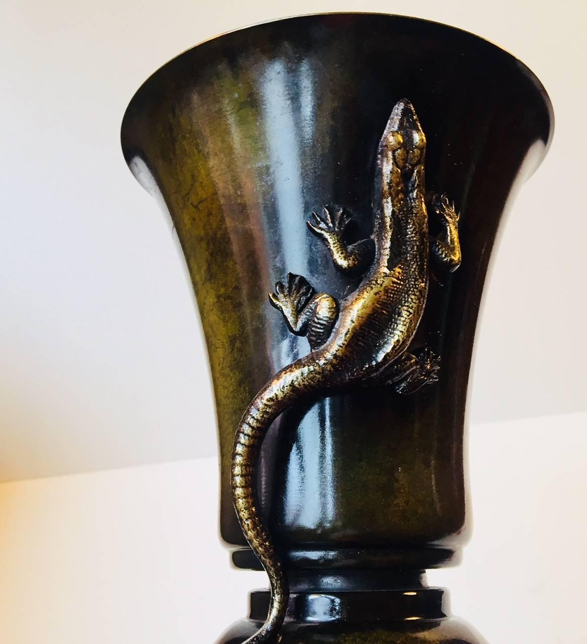 Danish 1930s interpretation of Japanese Meiji period where snakes, lizards and crocodiles were configured upon organically shaped and rather
'modernistic' bronze vases and bowls. This vase was designed and manufactured by H. F Bronce in Denmark