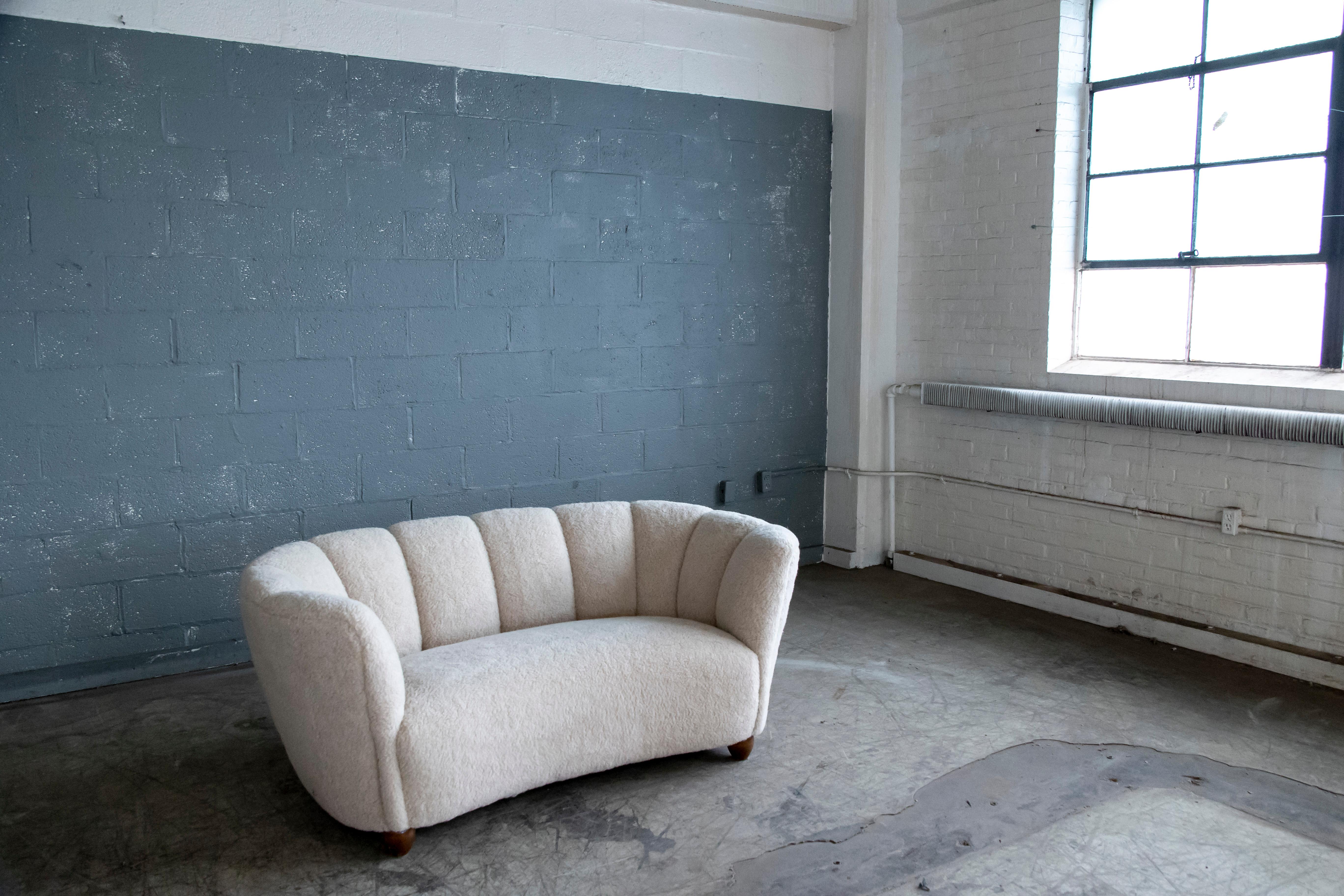 Mid-20th Century Danish 1940's Banana Shaped Curved Loveseat or Sofa Covered in Beige Lambswool