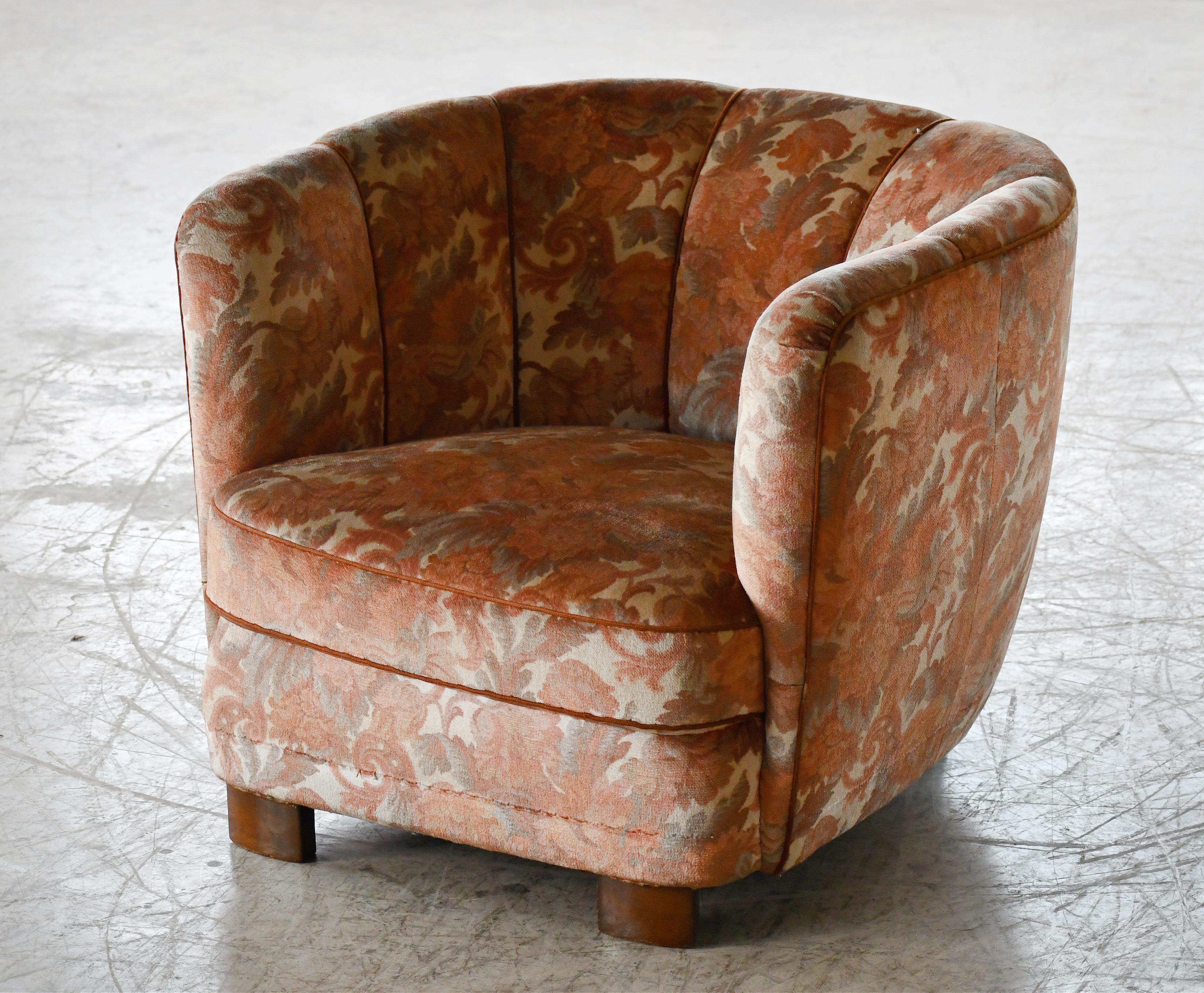Comfortable, exuberant, and superbly made Danish lounge chair perfectly capturing the essence of 1940s Danish design bridging the the period between the Art Deco and the midcentury periods. These type of chairs were made to match the curved sofas
