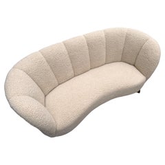 Danish 1940s bananasofa in new sheepskin.