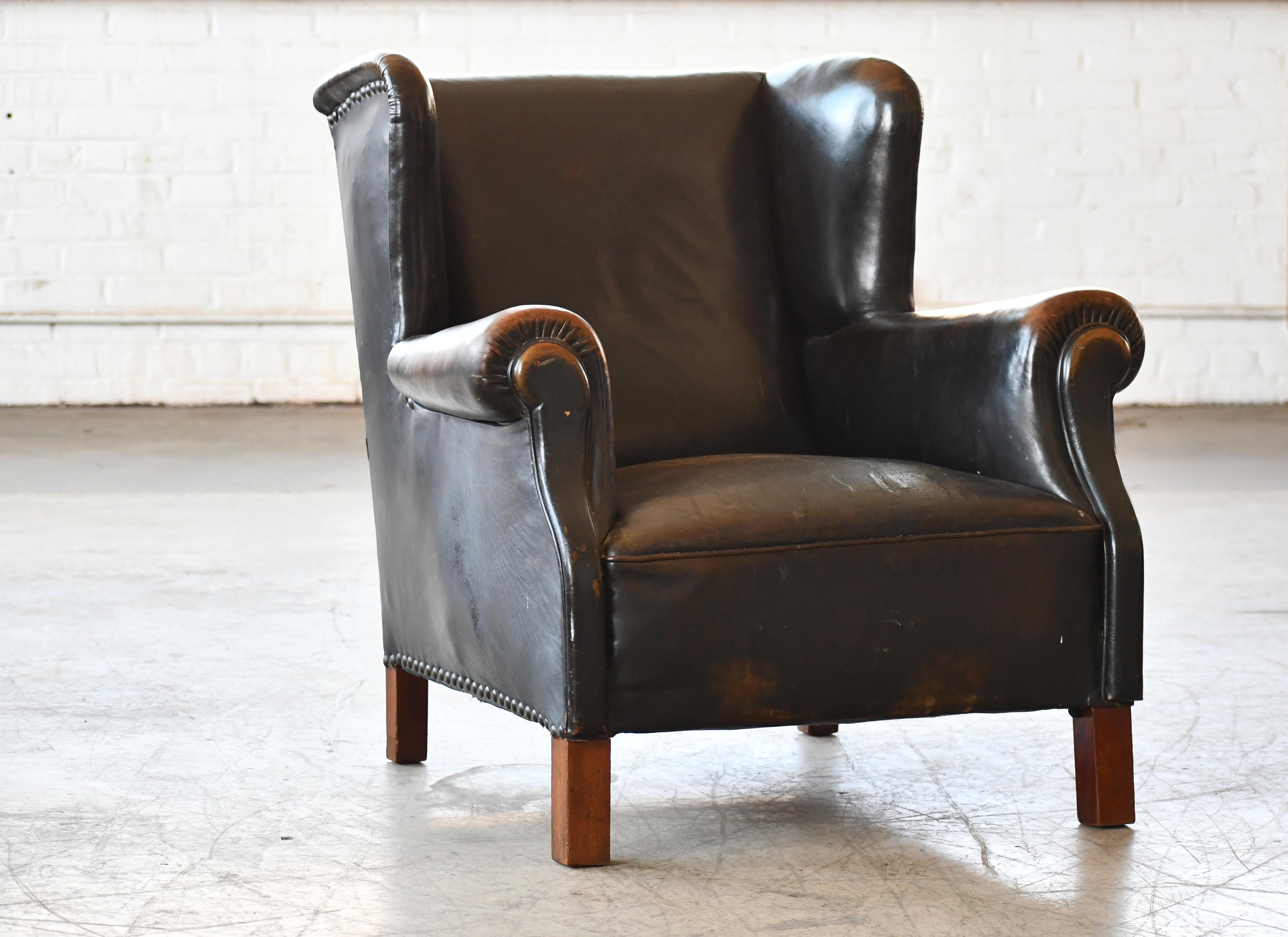 Mid-Century Modern Danish 1940's Black Leather Large Wingback Lounge Chair with Patina