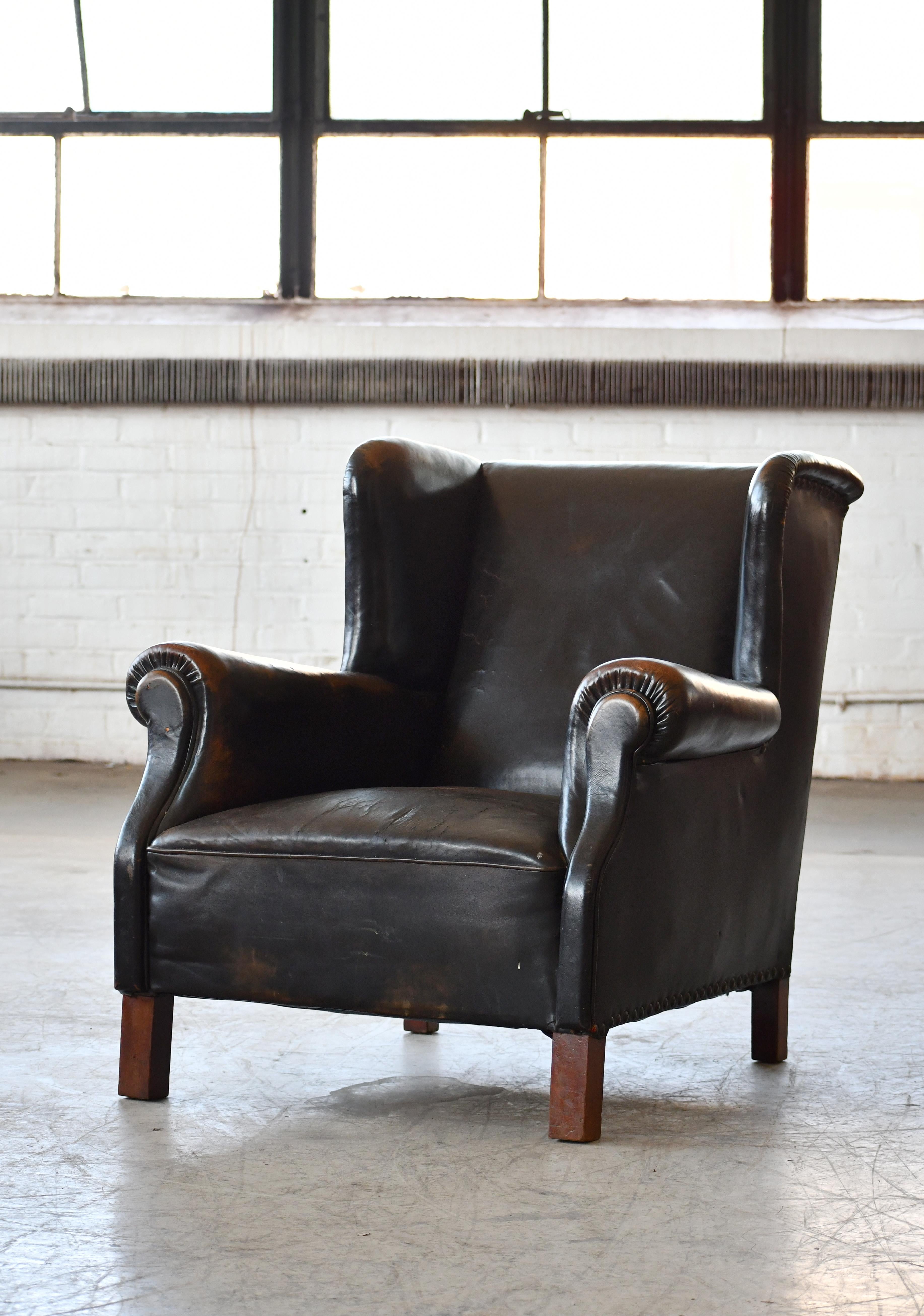 Mid-20th Century Danish 1940's Black Leather Large Wingback Lounge Chair with Patina