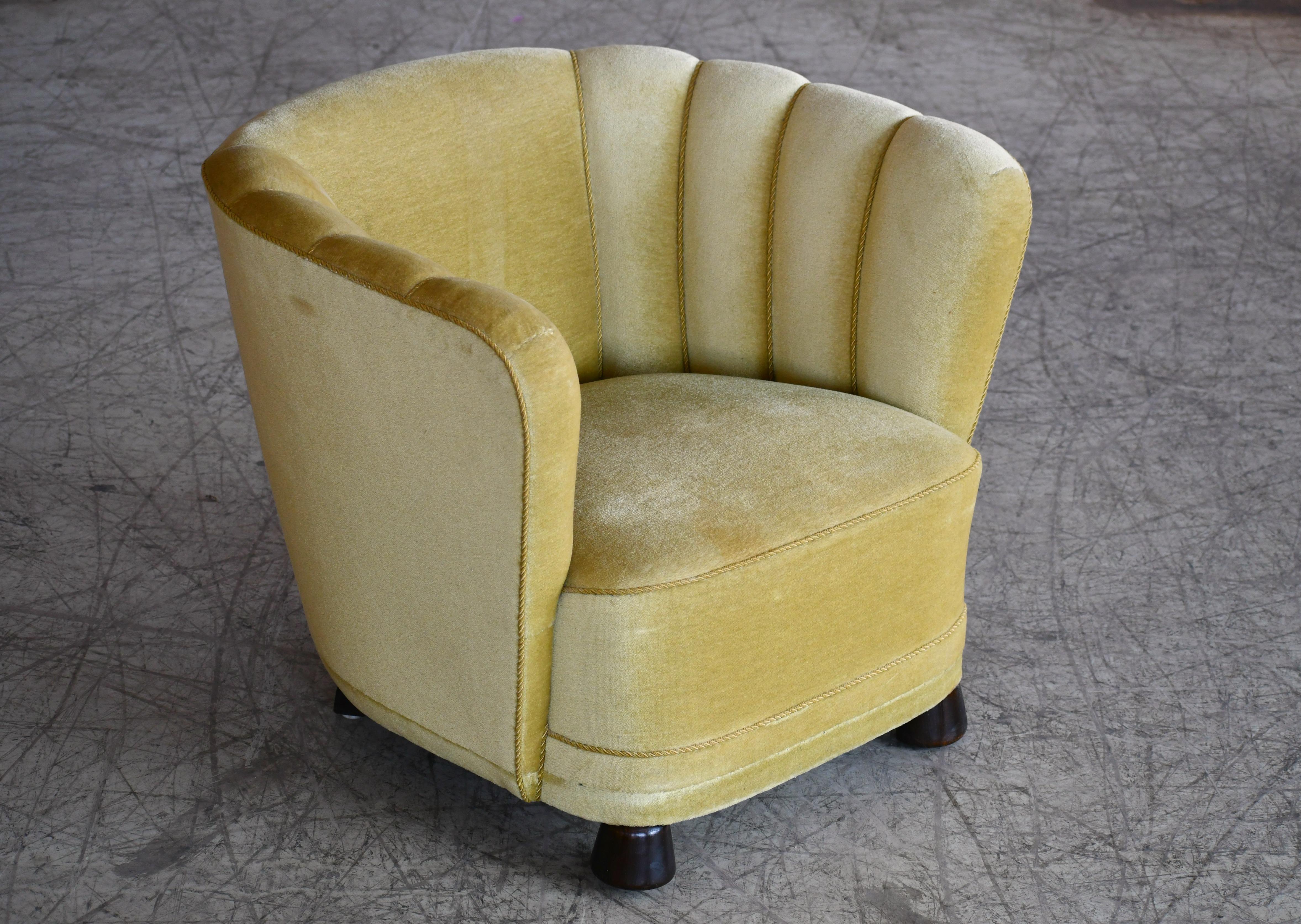 This supercool 1940s Danish curved club chair is actually a match to the Danish curved or banana form sofas made in the 1930s-1940s. The sofas and chairs were very popular coming out of the 1930s and into the early 1940s and inspired by the Art Deco