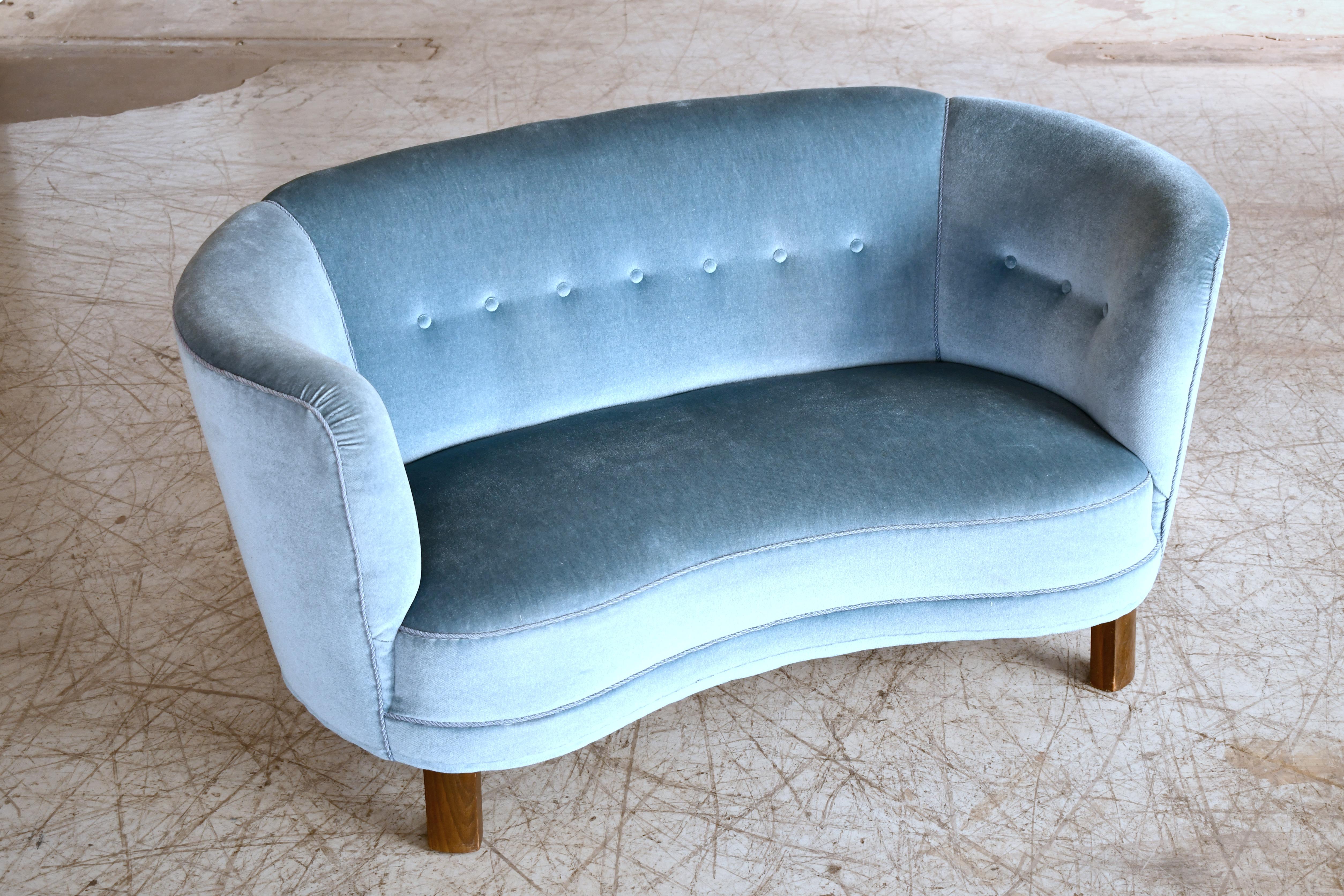 Beautiful and very elegant 1940s curved two-seat sofa or in teal blue mohair wool fabric. The sofa has springs in the seat and the backrest and the cushions are nice and firm and the sofa very sturdy. The sofa was re-upholstered in recent years and