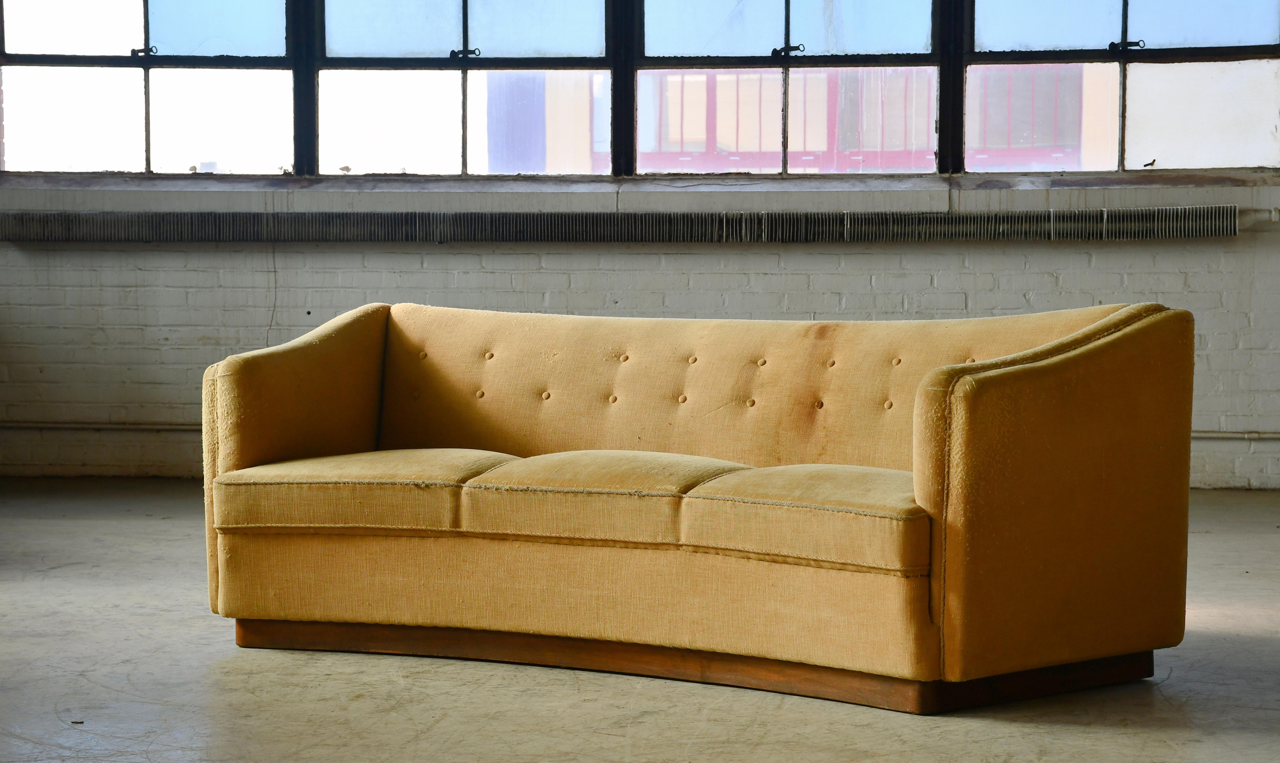 Superb and rare sofa designed by Ole Wanscher and produced by Fritz Hansen as model 1668 probably in the 1940. The model was seen in Fritz Hansen's catalog #4202 in 1942. Sturdy and strong with a charming and cool presence to anchor any room. Strong